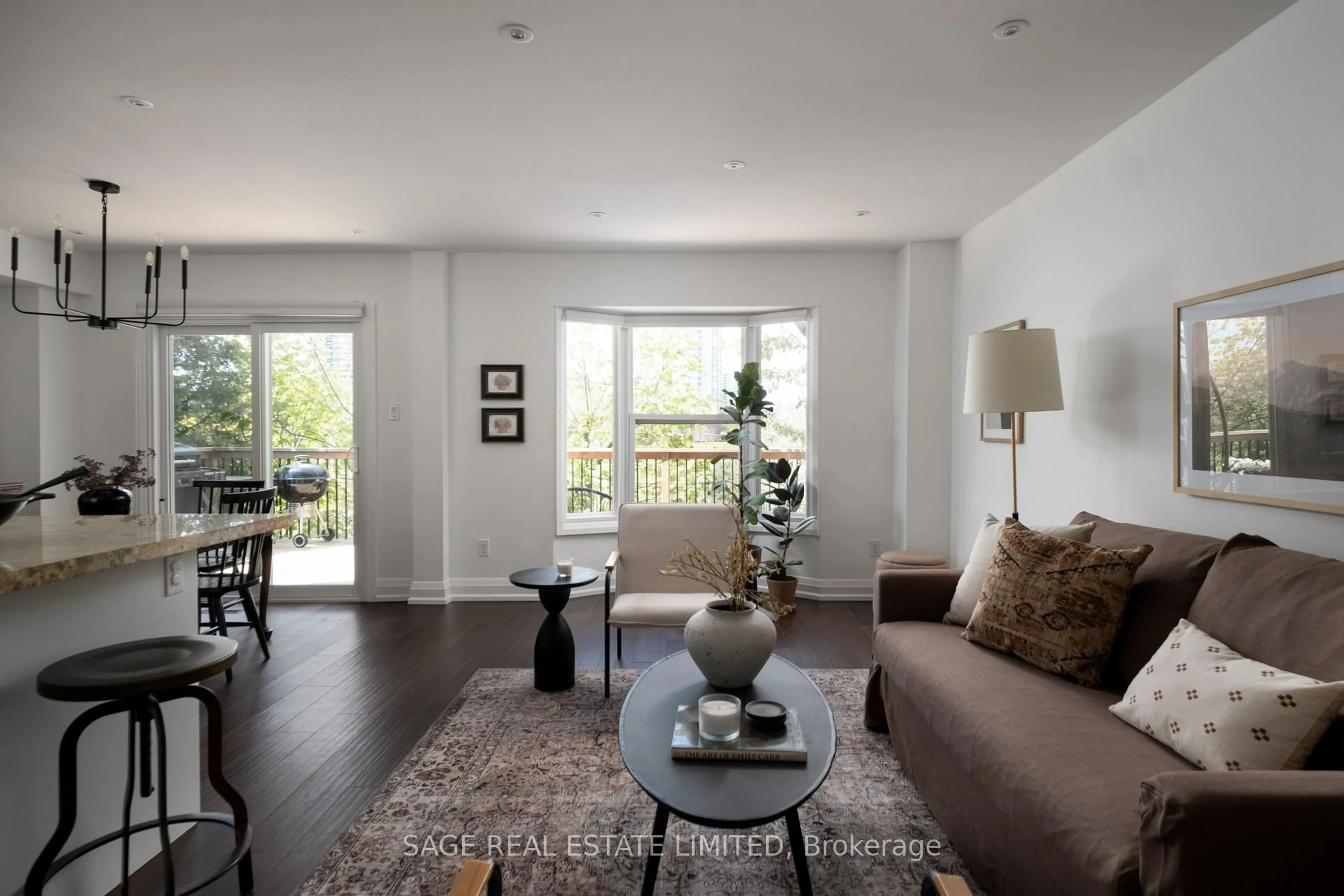 Living room with furniture, wood/laminate floor for 34 Tambrook Dr, Toronto Ontario M1W 3L9