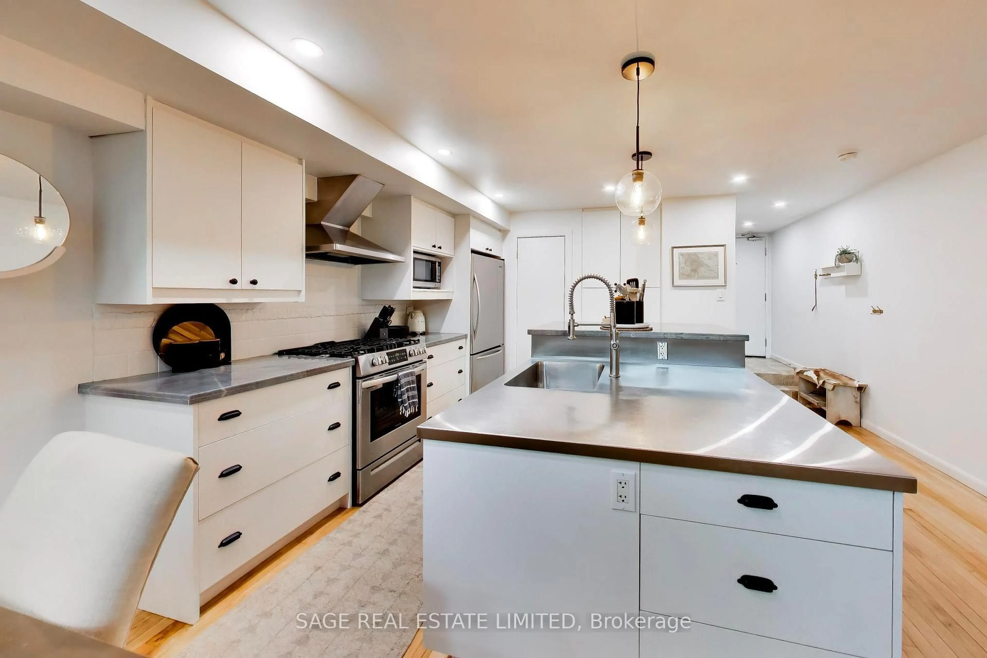 Open concept kitchen, ceramic/tile floor for 660 Pape Ave #111, Toronto Ontario M4K 3S5