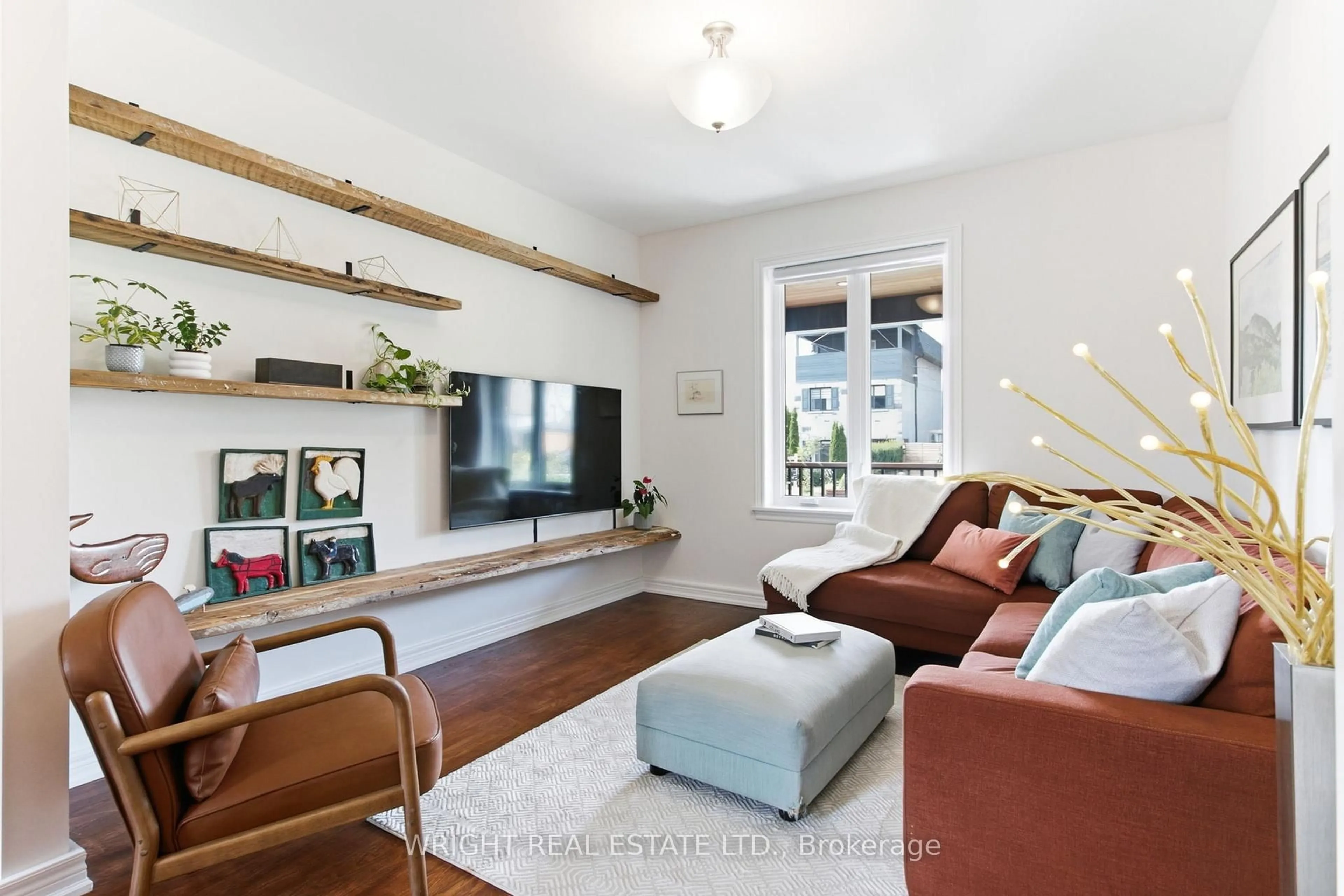 Living room with furniture, wood/laminate floor for 3 Midburn Ave, Toronto Ontario M4C 2C8