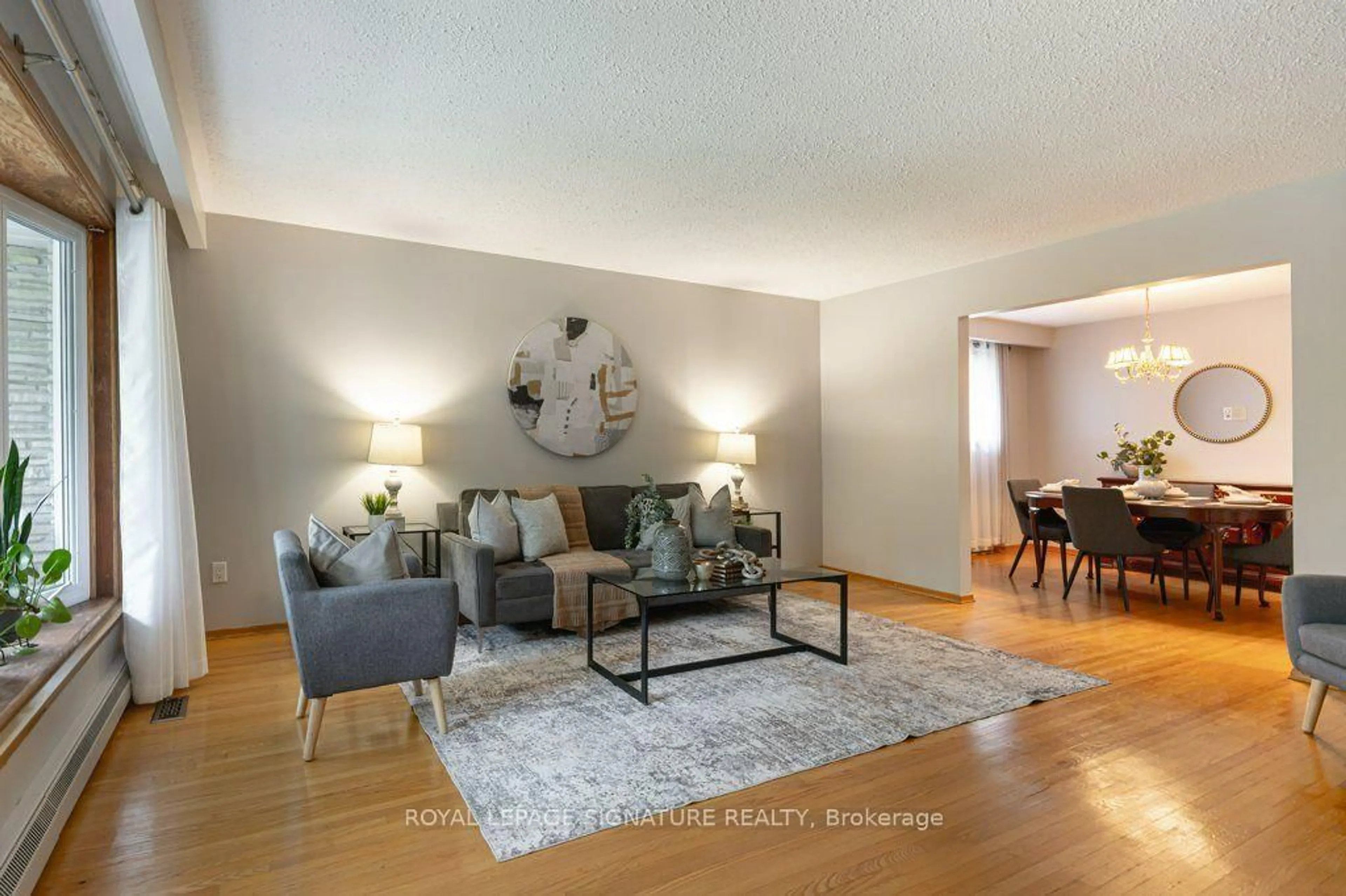 Living room with furniture, wood/laminate floor for 40 Holmcrest Tr, Toronto Ontario M1C 1V5