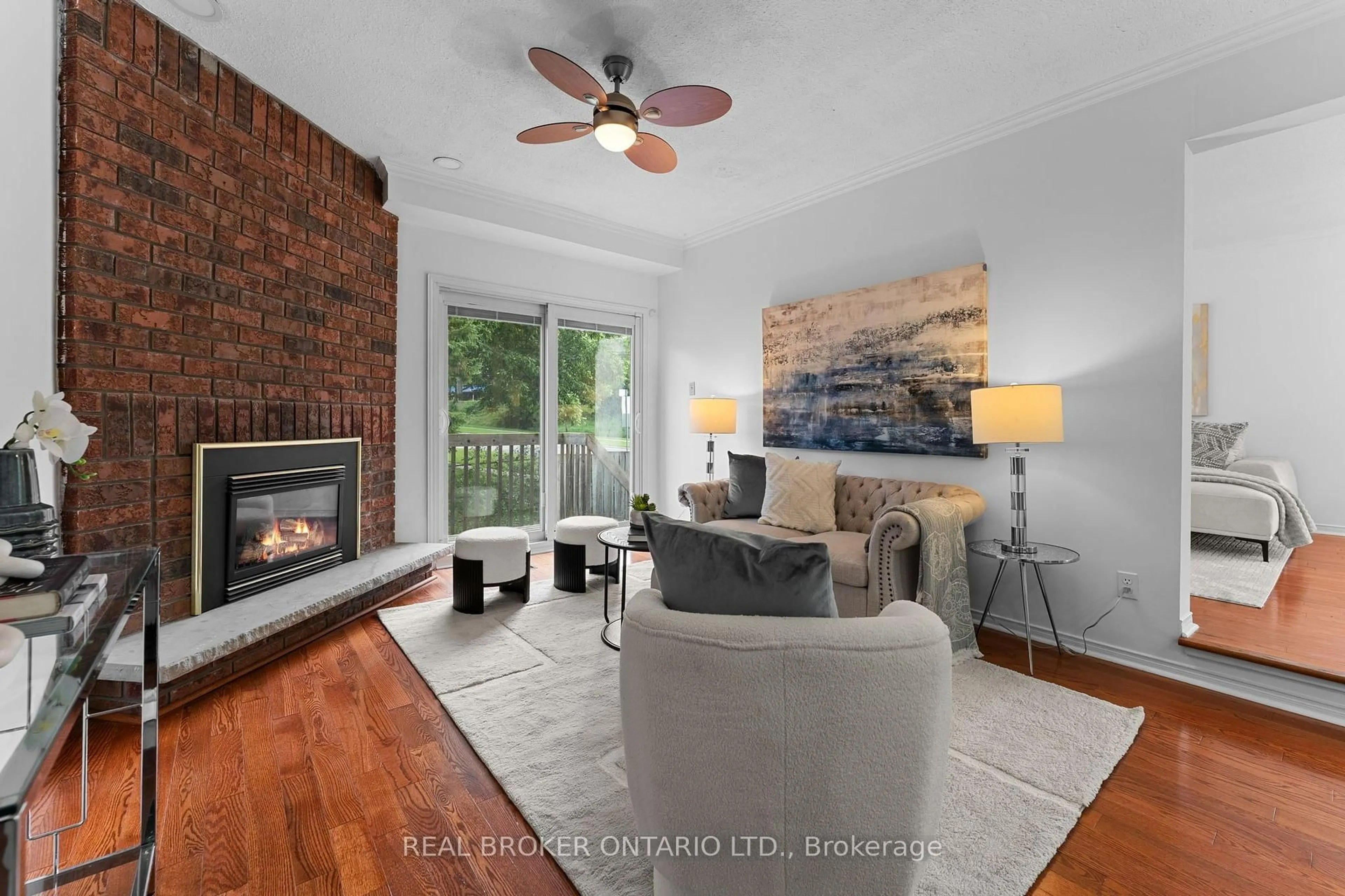 Living room with furniture, wood/laminate floor for 1 Baronial Crt, Toronto Ontario M1C 3J5