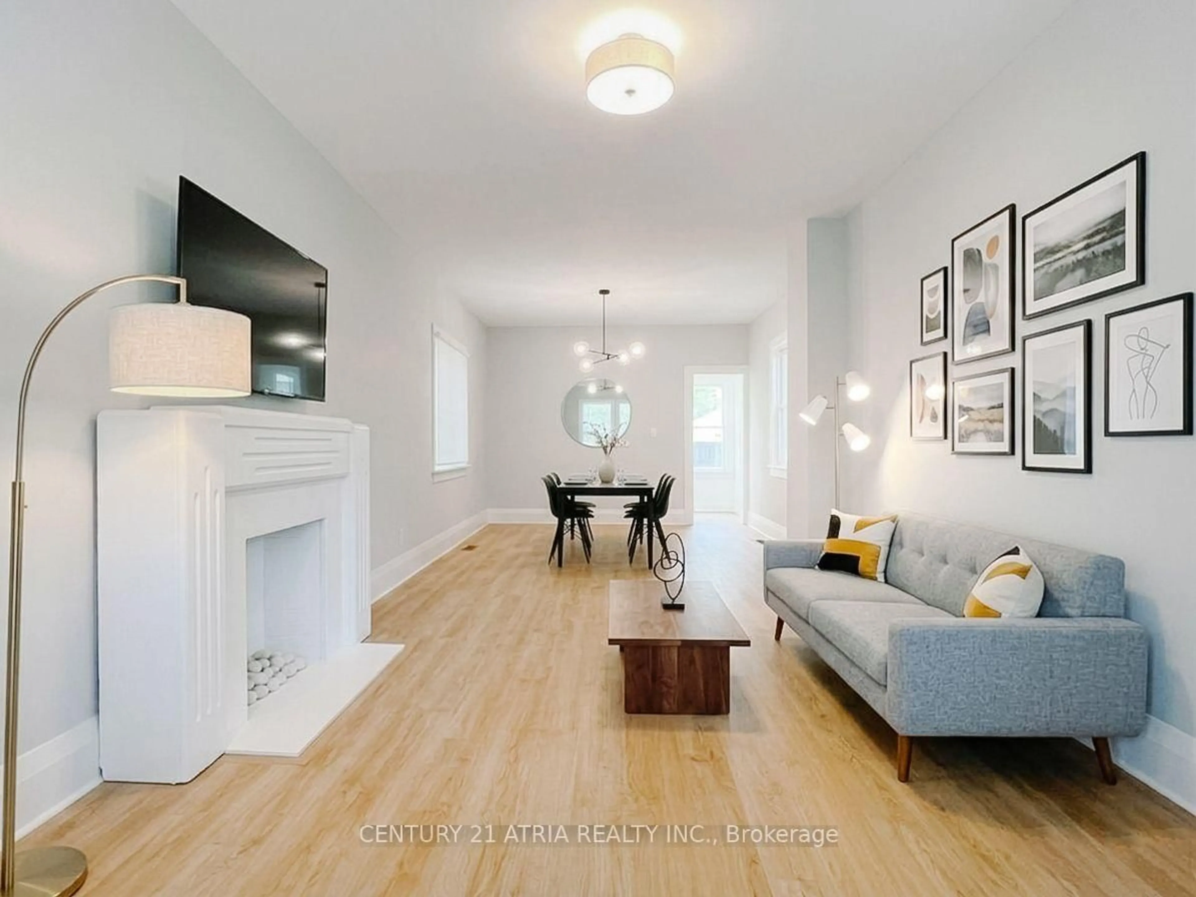 Living room with furniture, wood/laminate floor for 63 Bastedo Ave, Toronto Ontario M1T 1P5