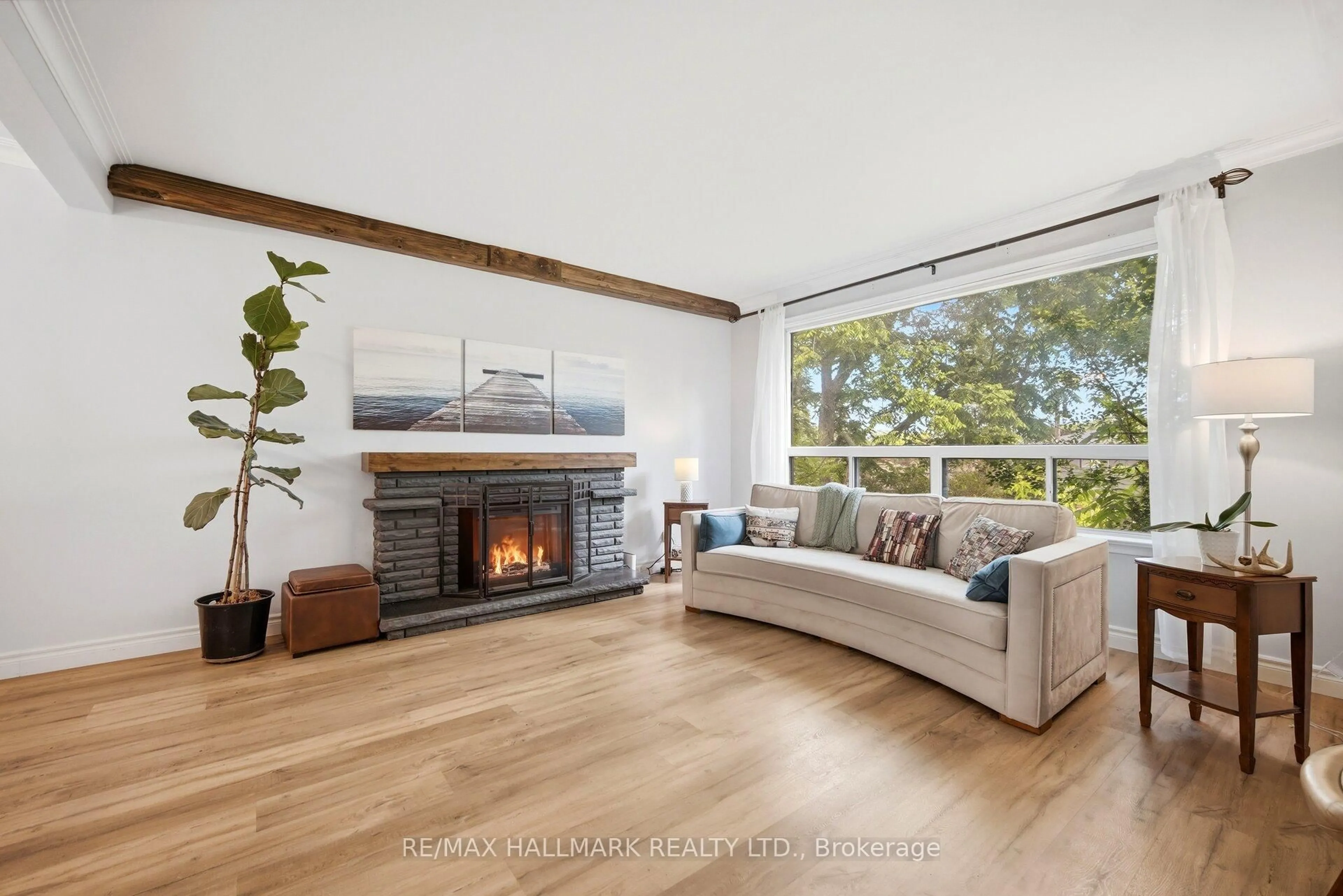 Living room with furniture, wood/laminate floor for 42 Catalina Dr, Toronto Ontario M1M 1K6