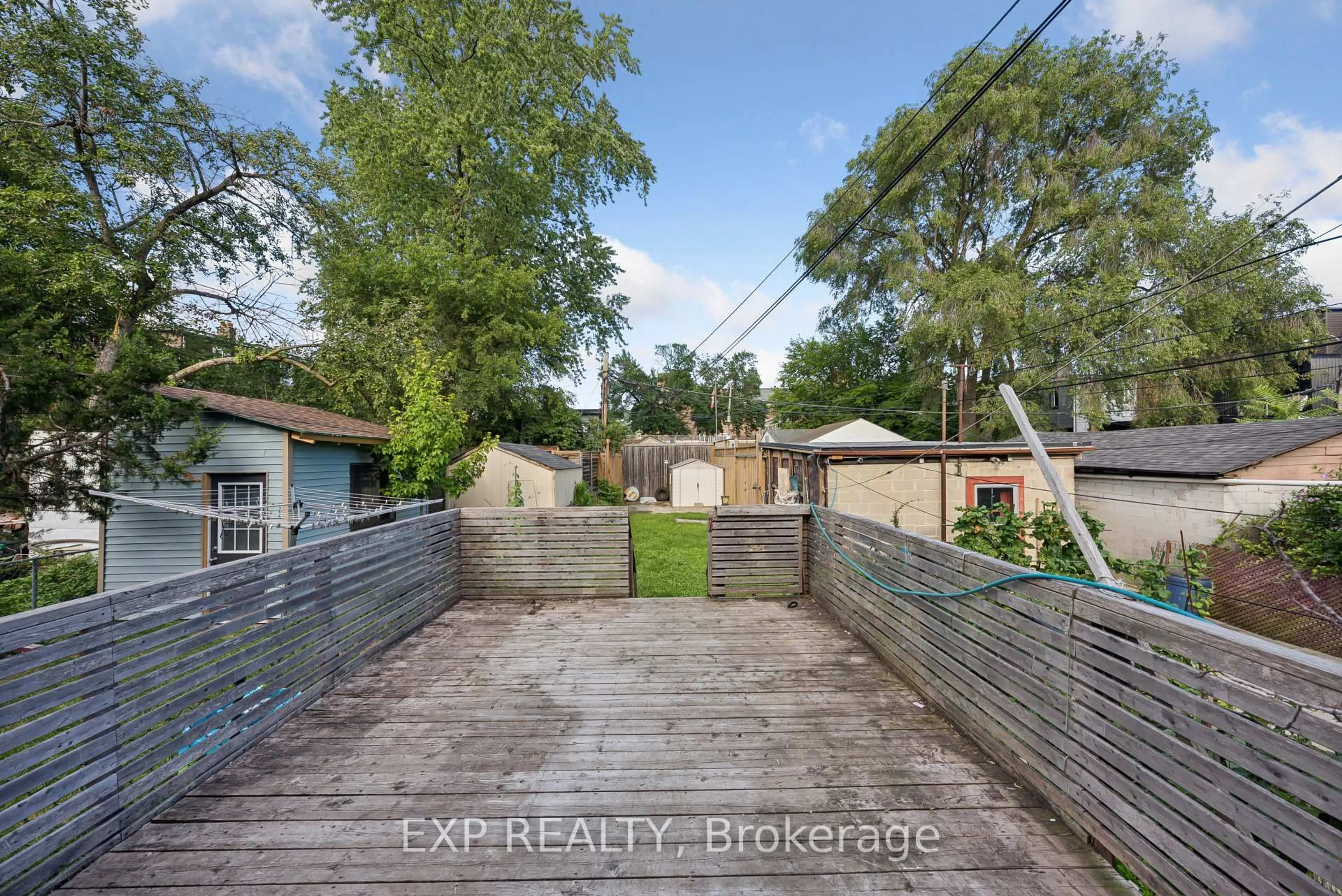 A pic from outside/outdoor area/front of a property/back of a property/a pic from drone, street for 511 Carlaw Ave, Toronto Ontario M4K 3J3