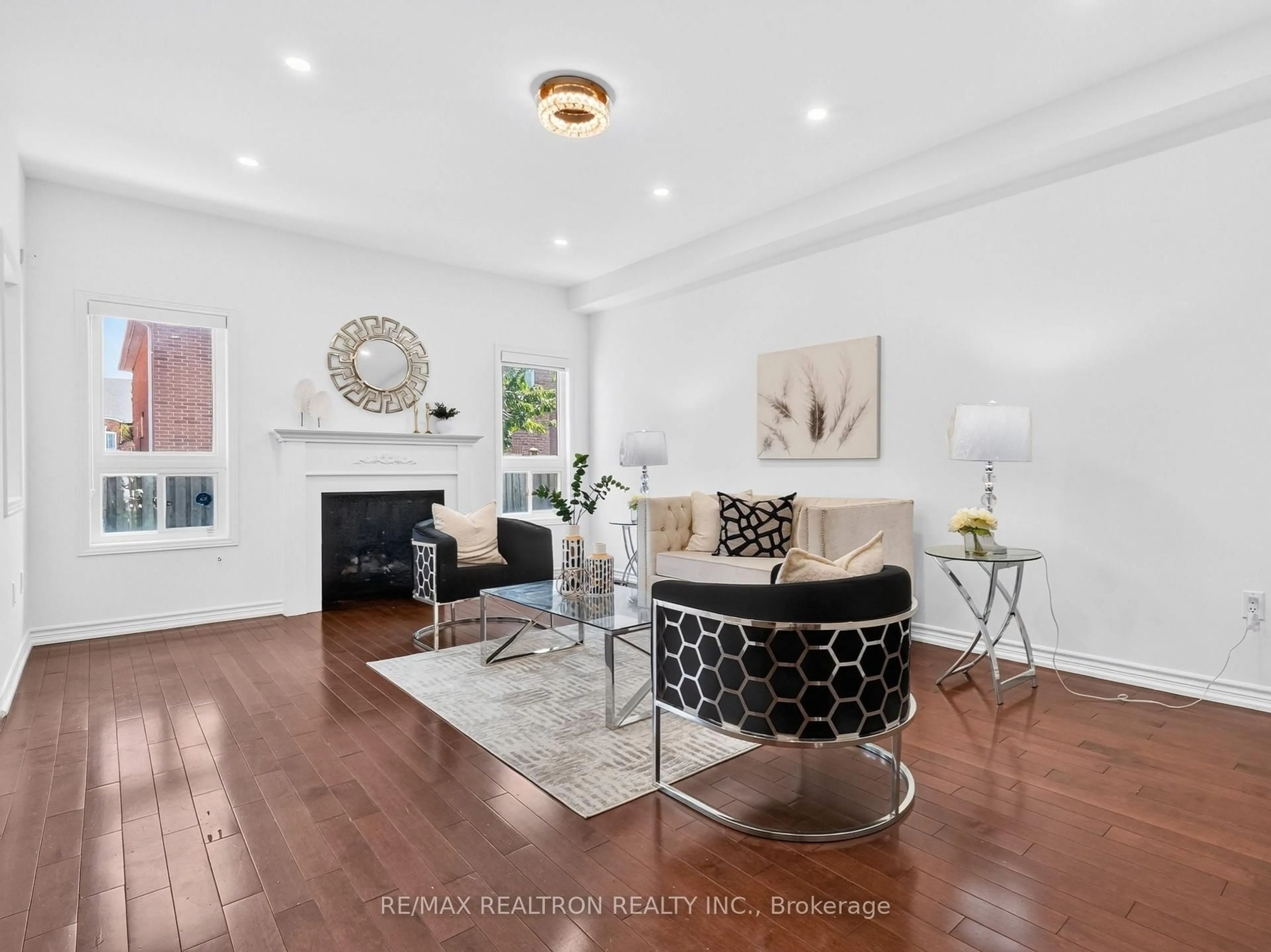 Living room with furniture, wood/laminate floor for 32 Whitlock Cres, Ajax Ontario L1Z 2B2