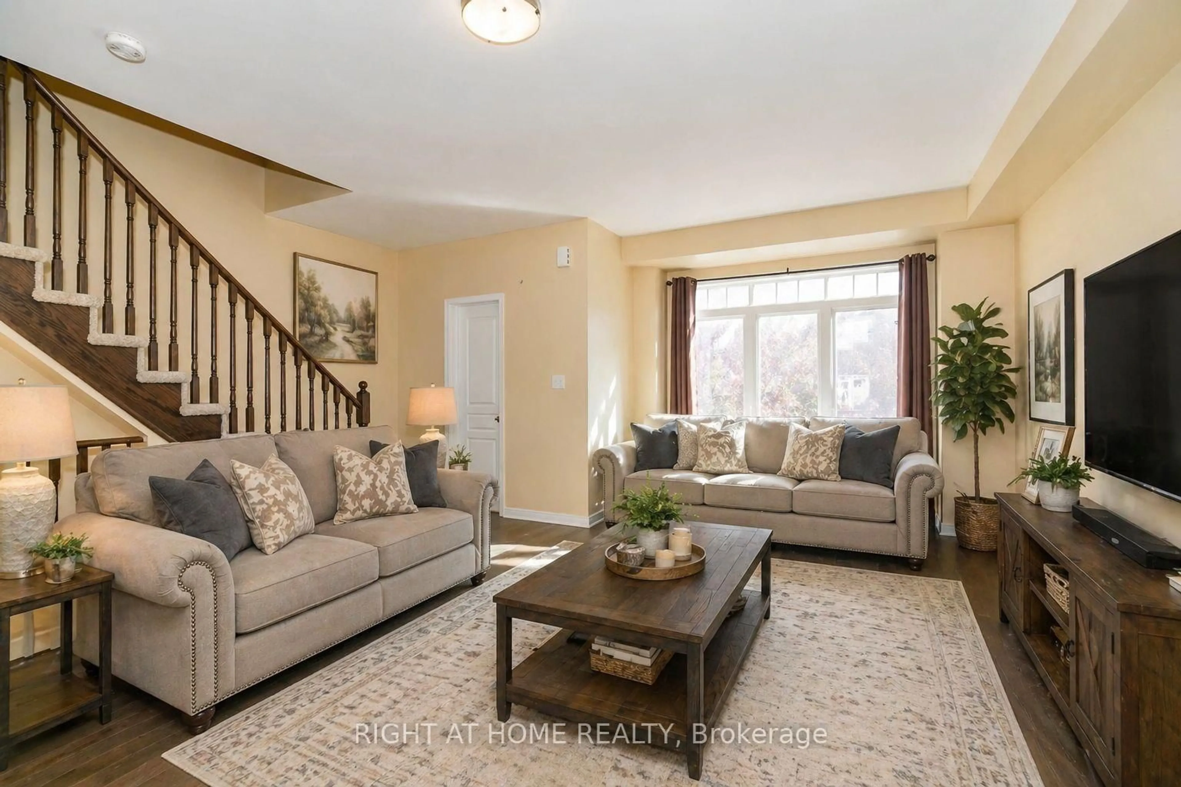 Living room with furniture, carpet floor for 48 Curran Hall Cres, Toronto Ontario M1G 0A2