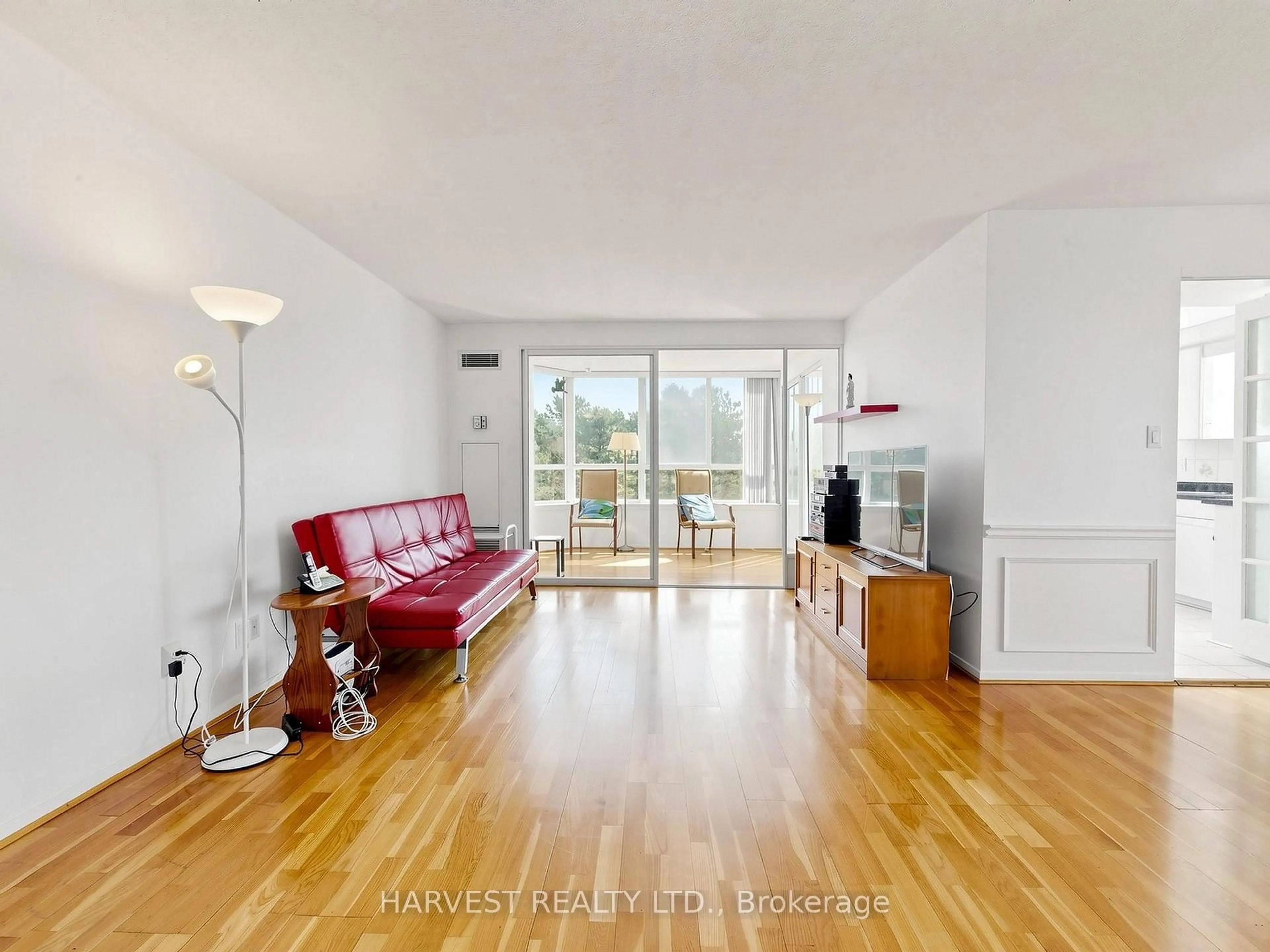 Living room with furniture, wood/laminate floor for 30 Thunder Grve #305, Toronto Ontario M1V 4A3