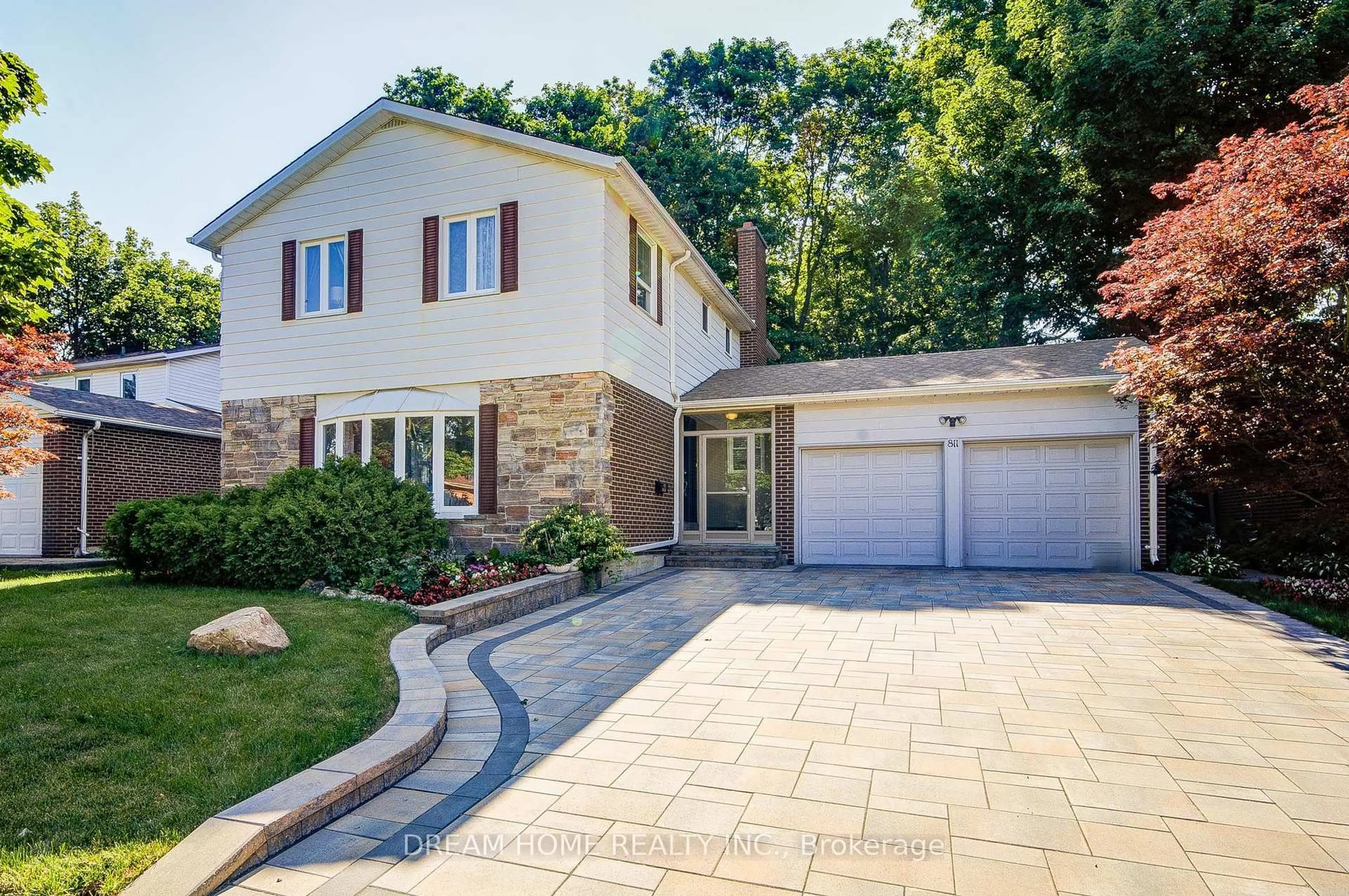Home with brick exterior material, street for 811 Huntingwood Dr, Toronto Ontario M1T 2L8