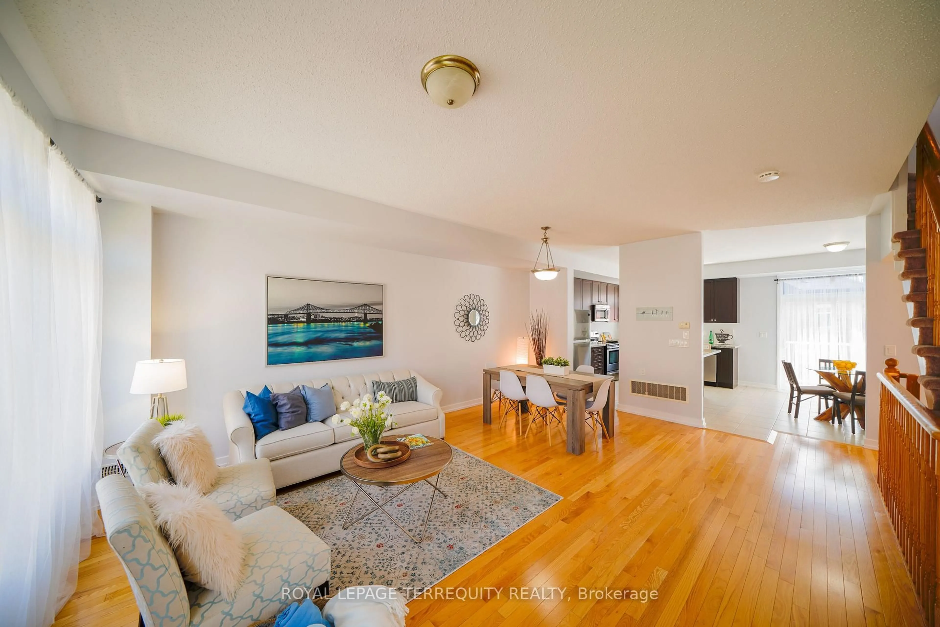 Living room with furniture, wood/laminate floor for 1299 Glenanna Rd #24, Pickering Ontario L1V 0C9