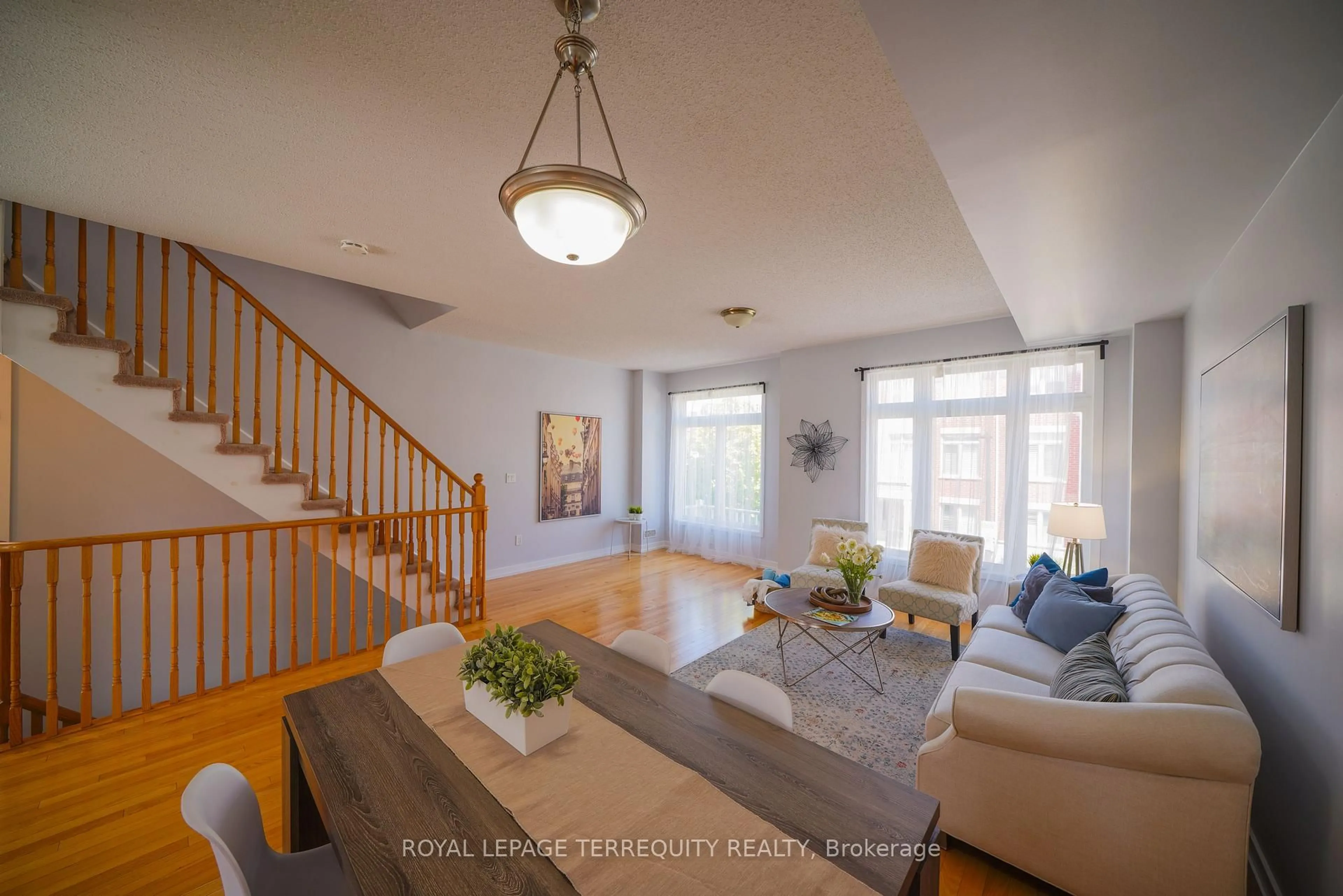 Living room with furniture, wood/laminate floor for 1299 Glenanna Rd #24, Pickering Ontario L1V 0C9