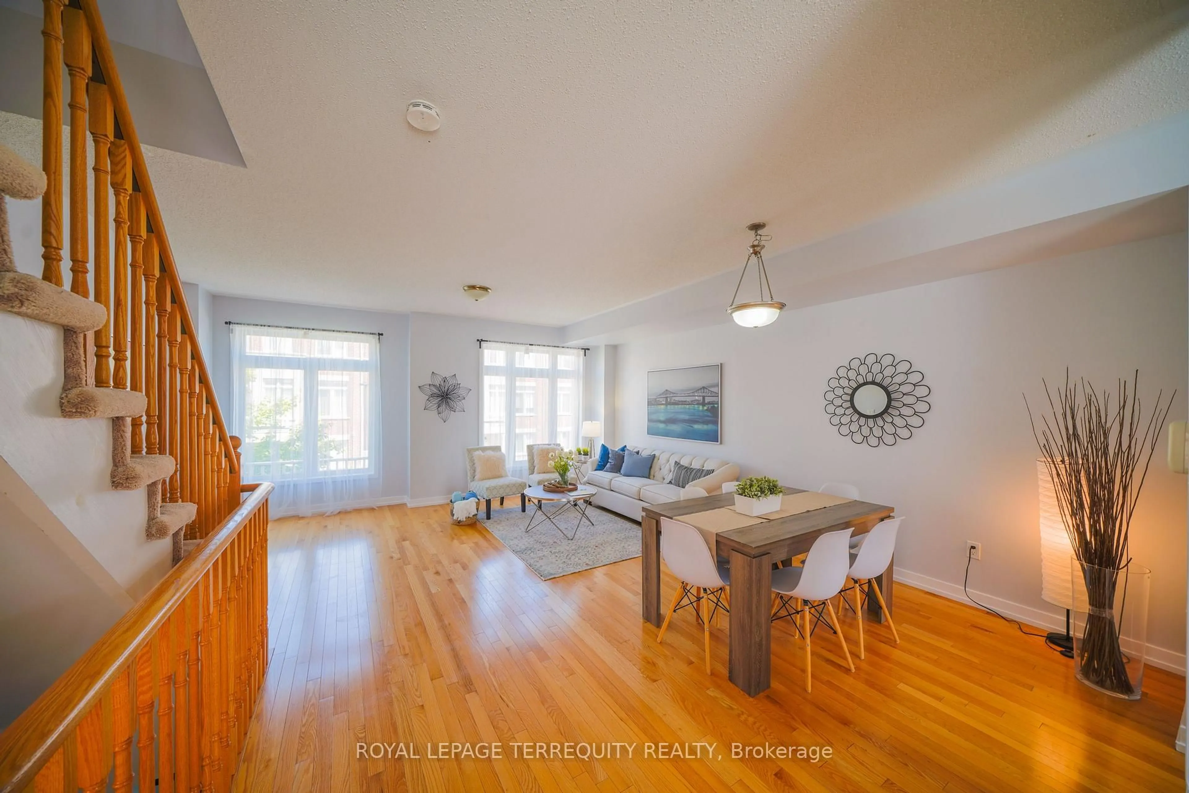 Living room with furniture, wood/laminate floor for 1299 Glenanna Rd #24, Pickering Ontario L1V 0C9