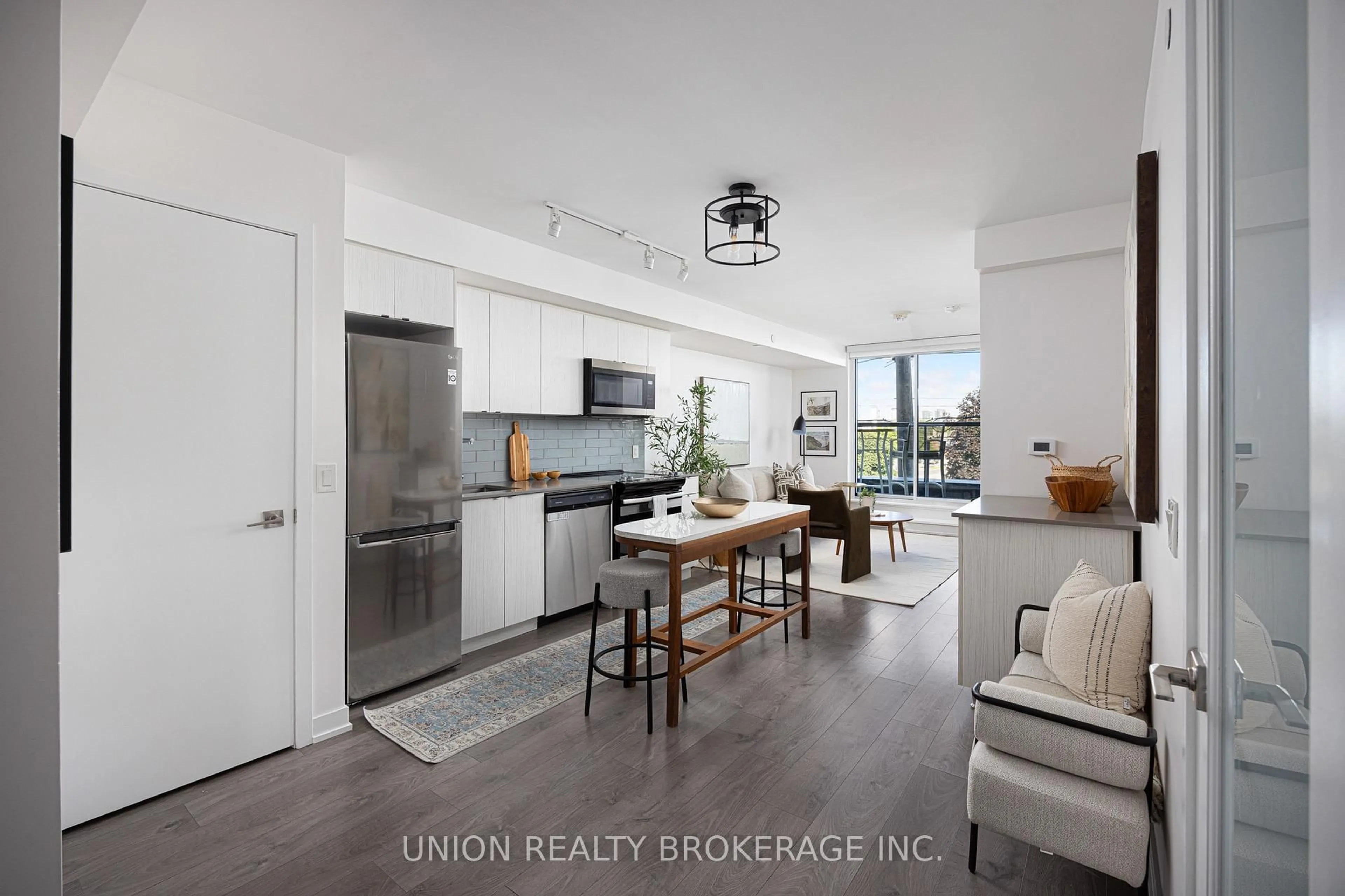 Open concept kitchen, wood/laminate floor for 1401 O'Connor Dr #217, Toronto Ontario M4B 2V5