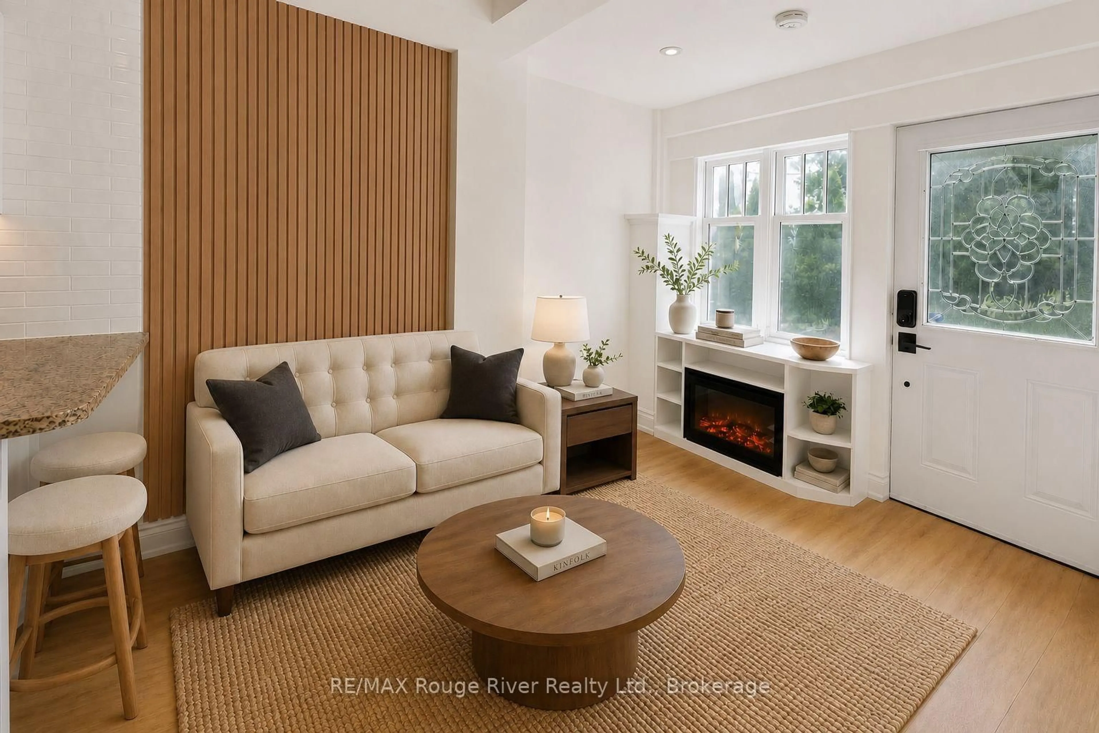 Living room with furniture, wood/laminate floor for 821 Craven Rd, Toronto Ontario M4L 2Z7