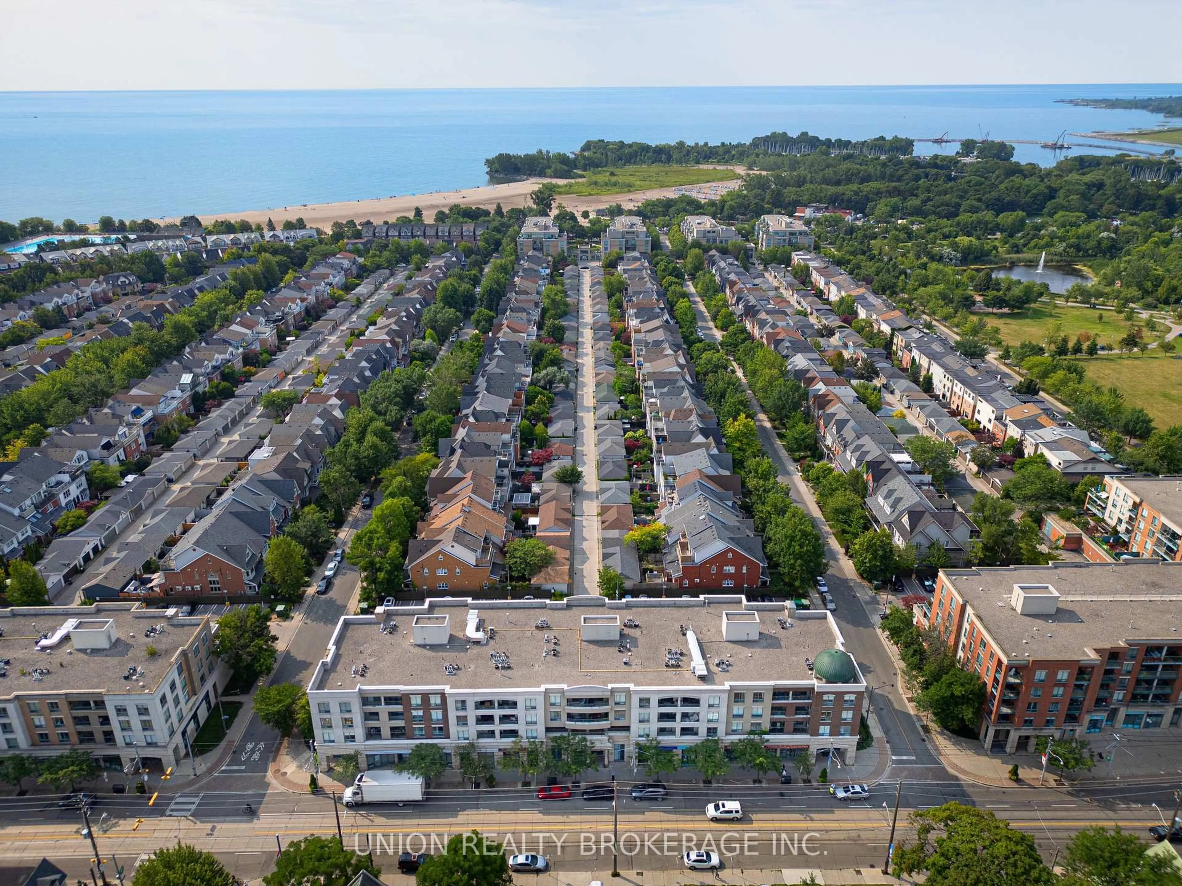 A pic from outside/outdoor area/front of a property/back of a property/a pic from drone, street for 1765 Queen St #213, Toronto Ontario M4L 3Z2
