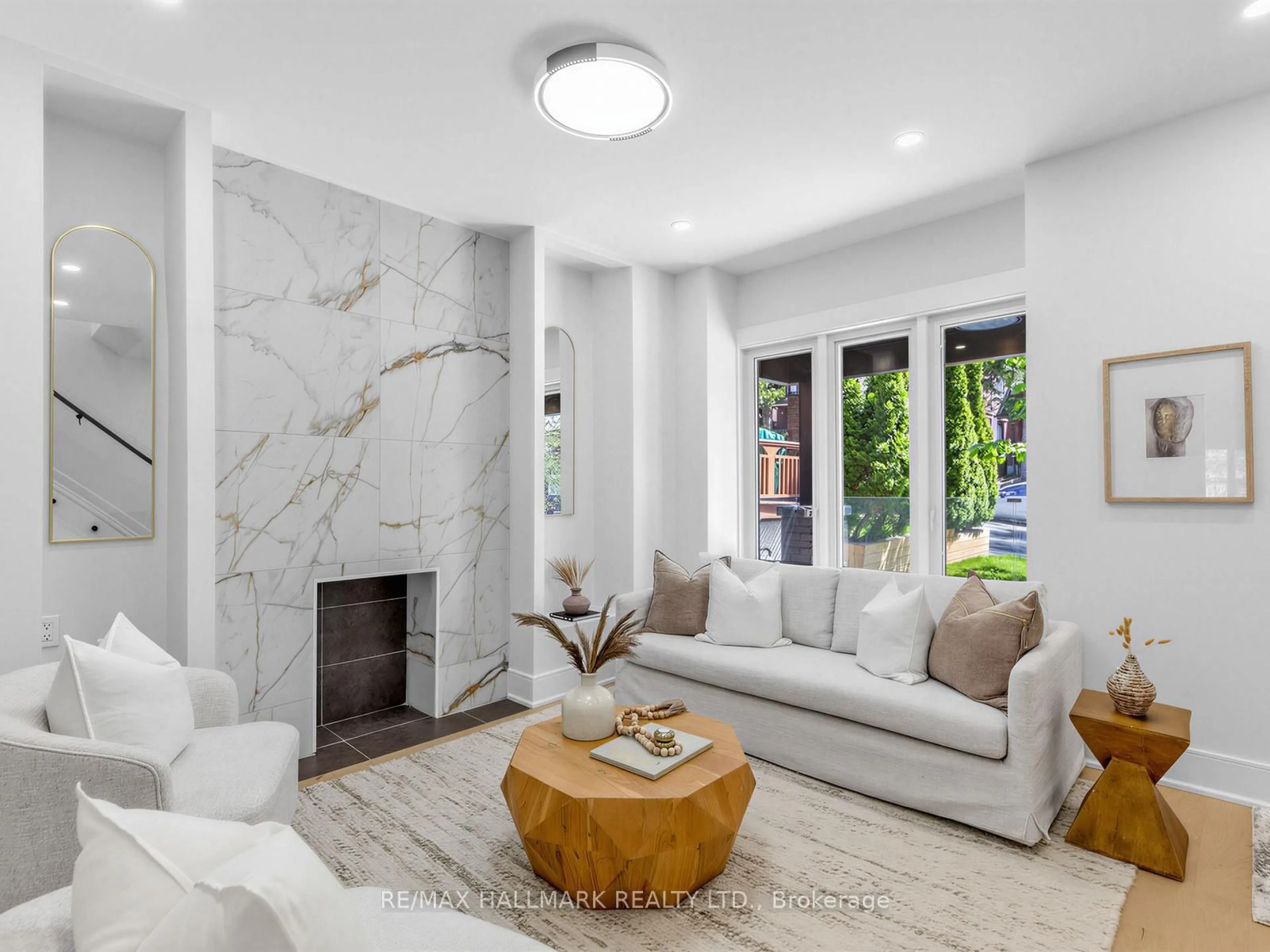 Living room with furniture, ceramic/tile floor for 208 Gainsborough Rd, Toronto Ontario M4L 3C6
