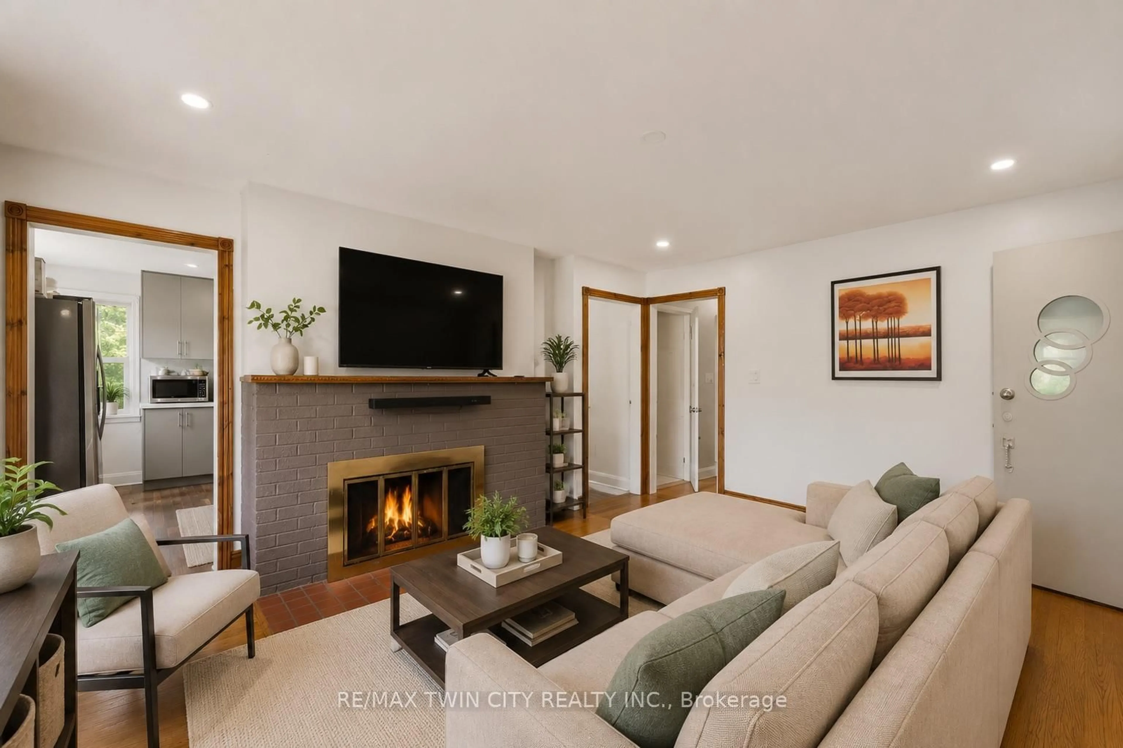 Living room with furniture, wood/laminate floor for 980 Ritson Rd, Oshawa Ontario L1G 6Z5