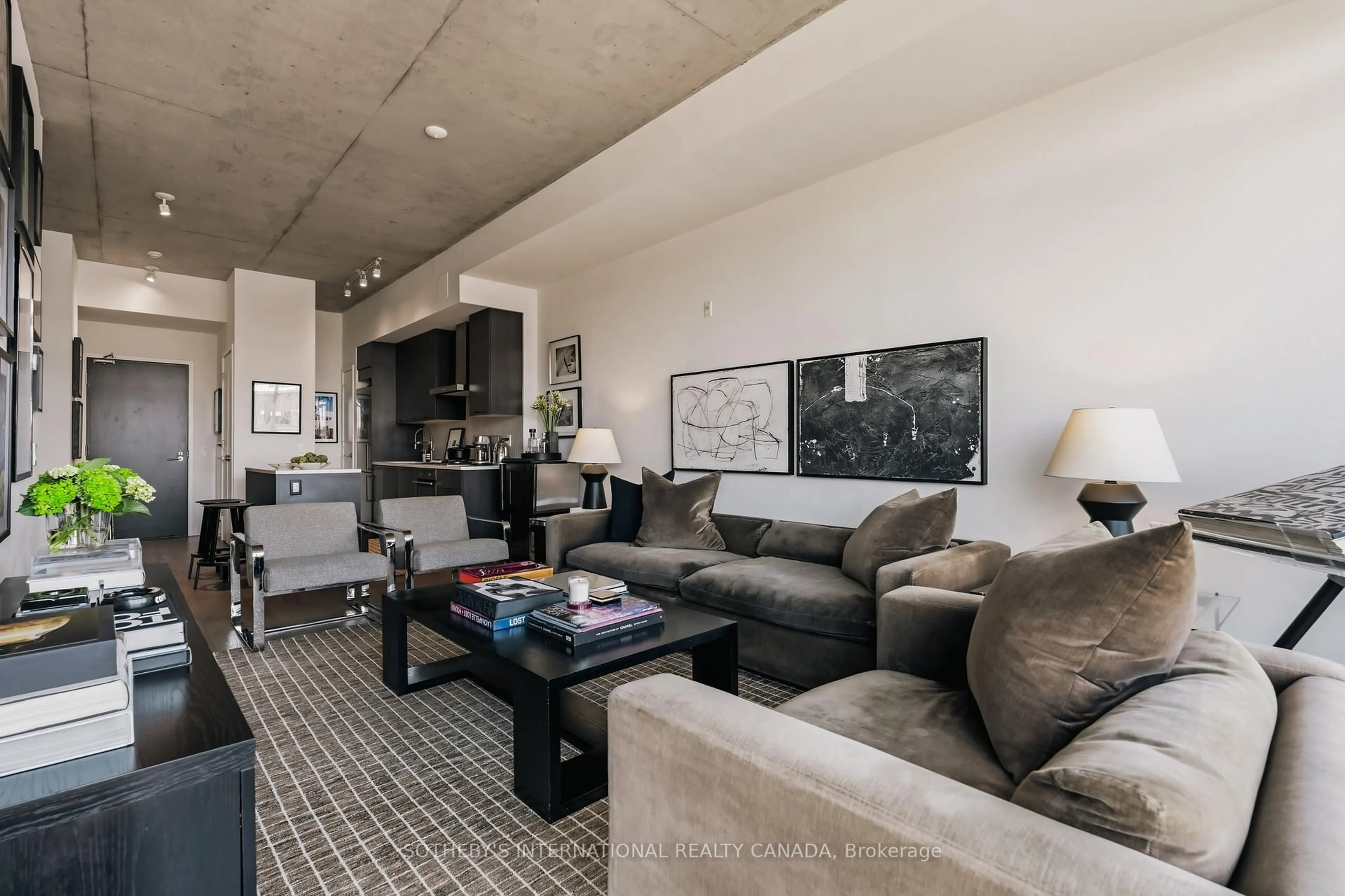 Living room with furniture, cement floor for 90 Broadview Ave #629, Toronto Ontario M4M 0A7