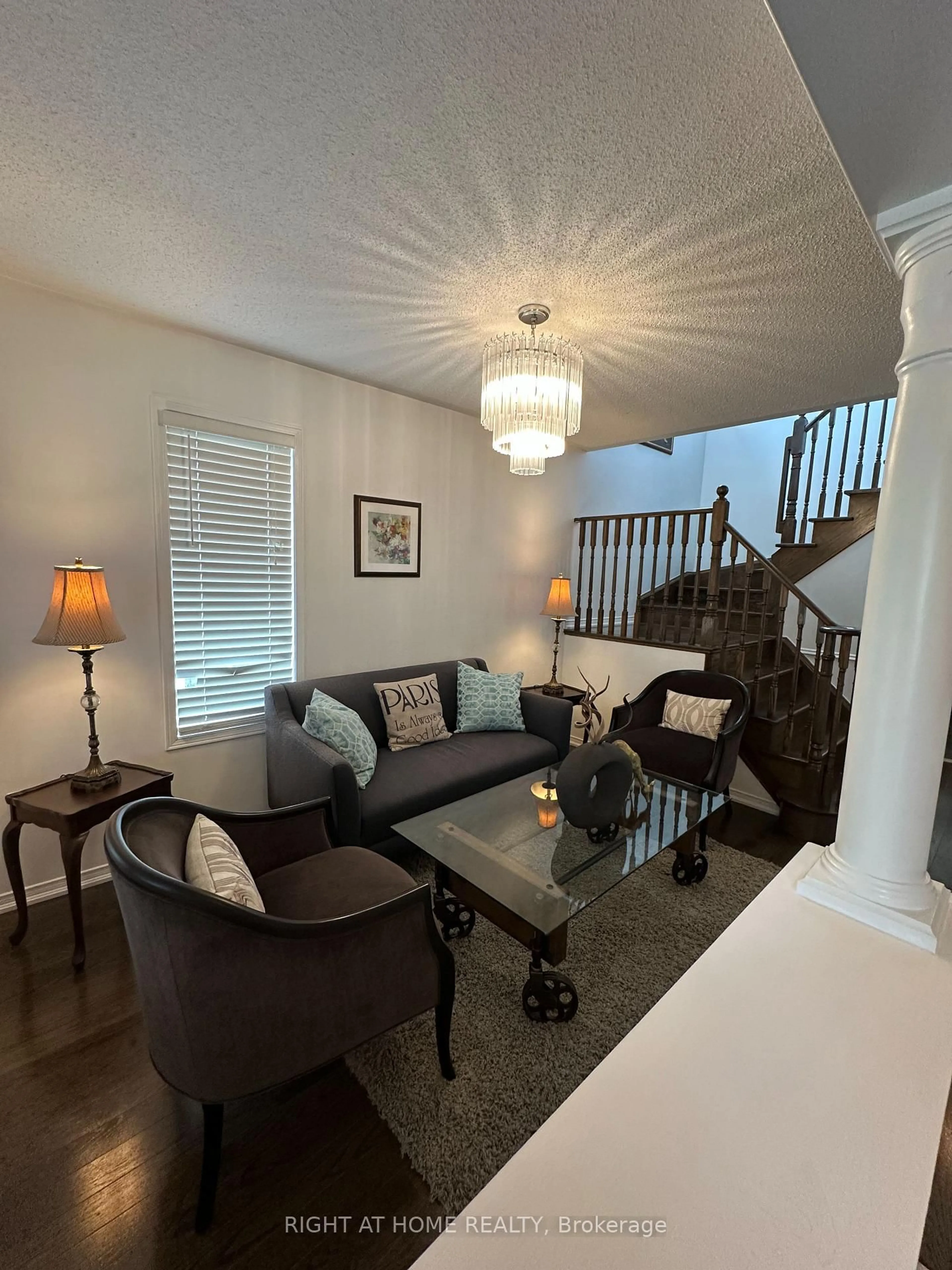 Living room with furniture, wood/laminate floor for 107 Norland Circ, Oshawa Ontario L1L 0A7