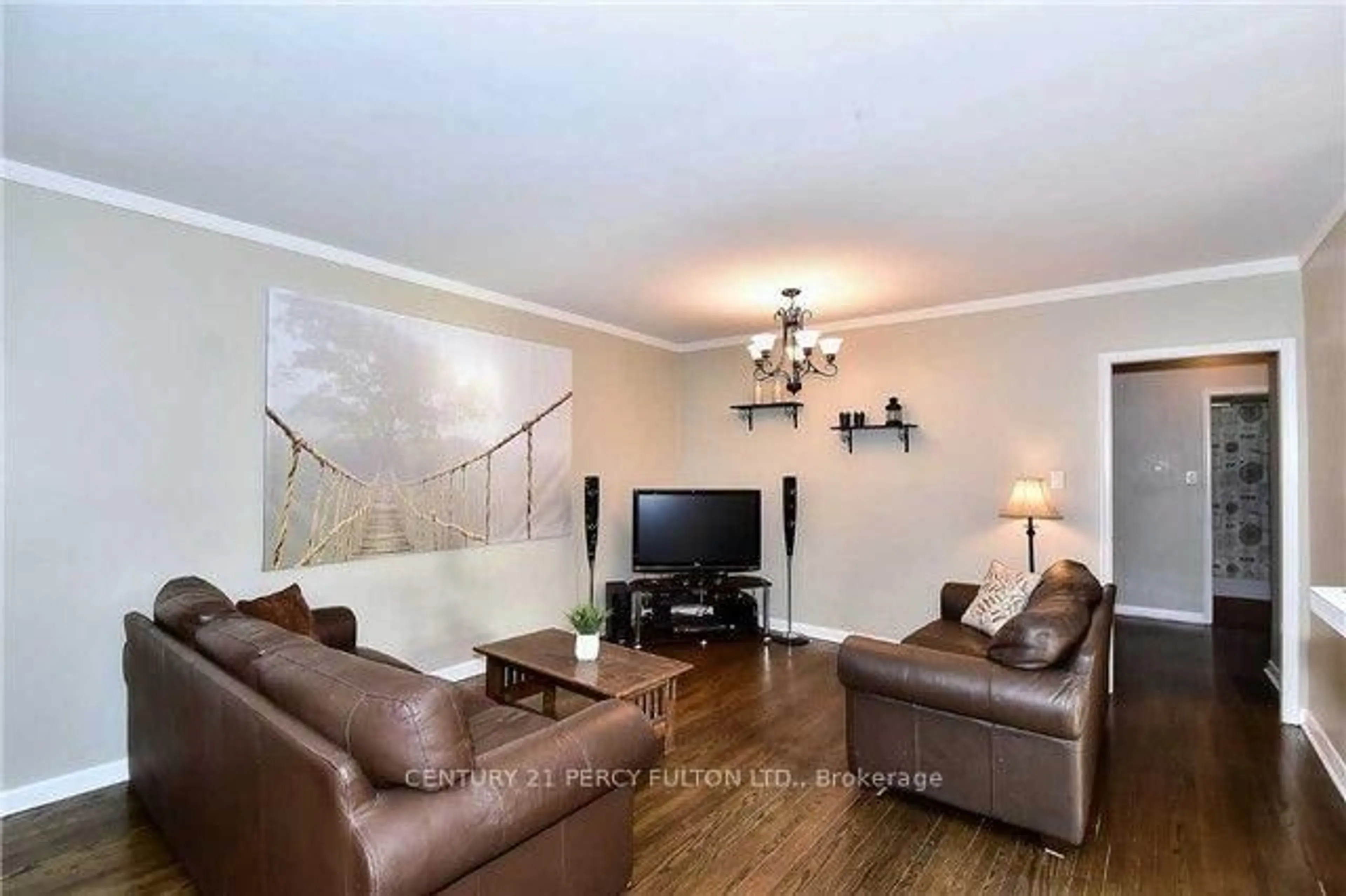 Living room with furniture, wood/laminate floor for 143 Tulloch Dr, Ajax Ontario L1S 2S7