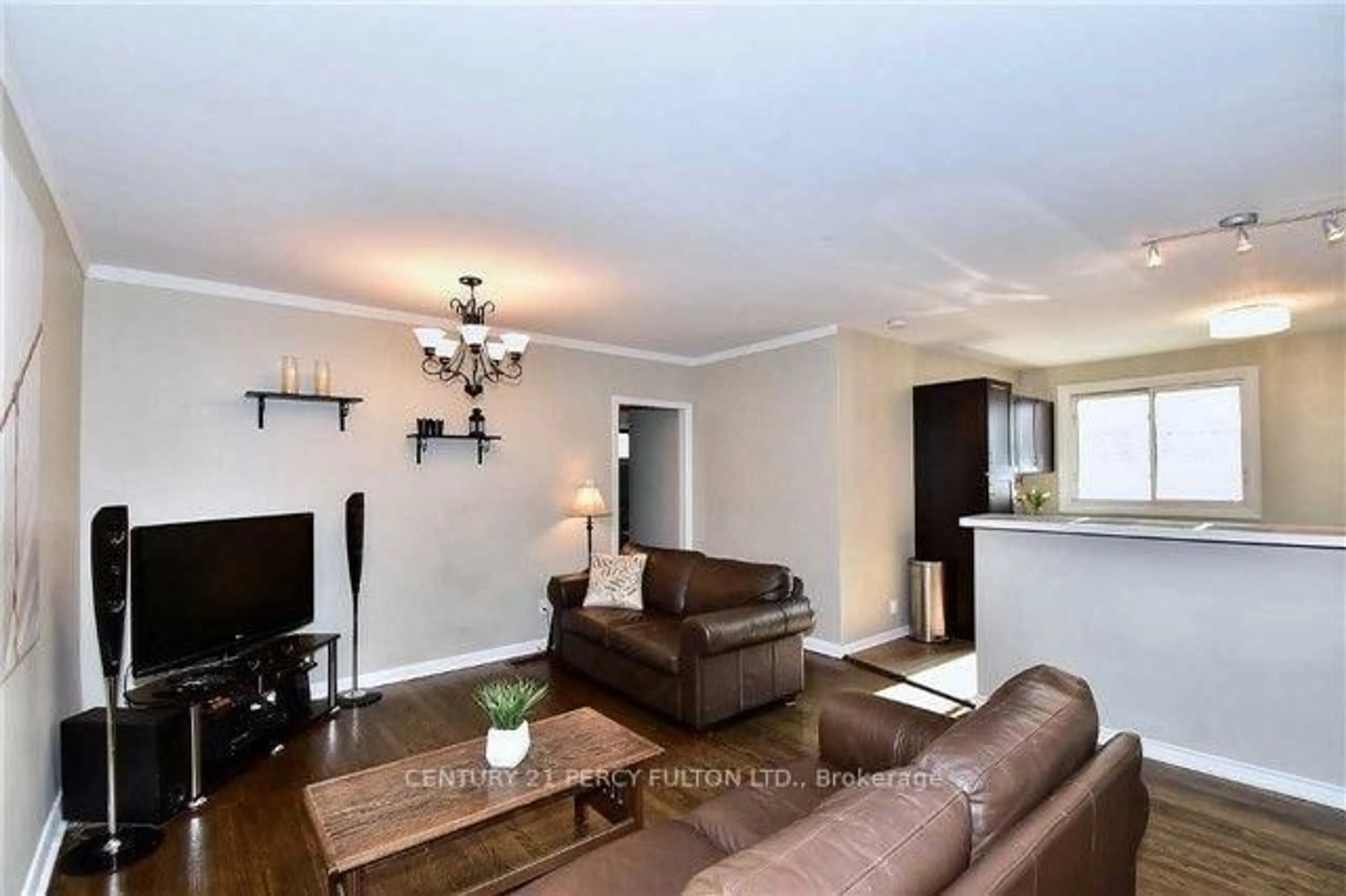 Living room with furniture, wood/laminate floor for 143 Tulloch Dr, Ajax Ontario L1S 2S7