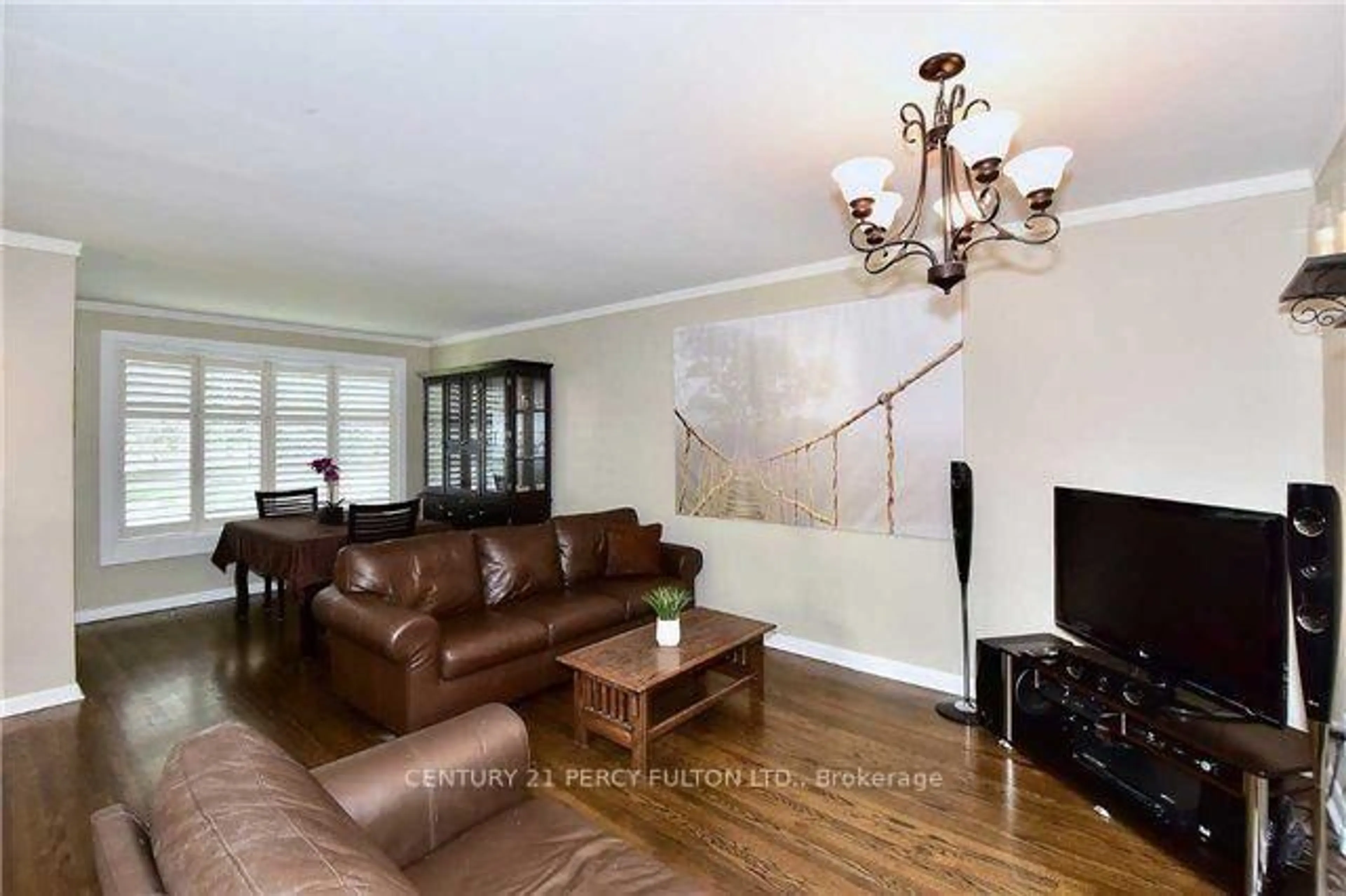Living room with furniture, wood/laminate floor for 143 Tulloch Dr, Ajax Ontario L1S 2S7