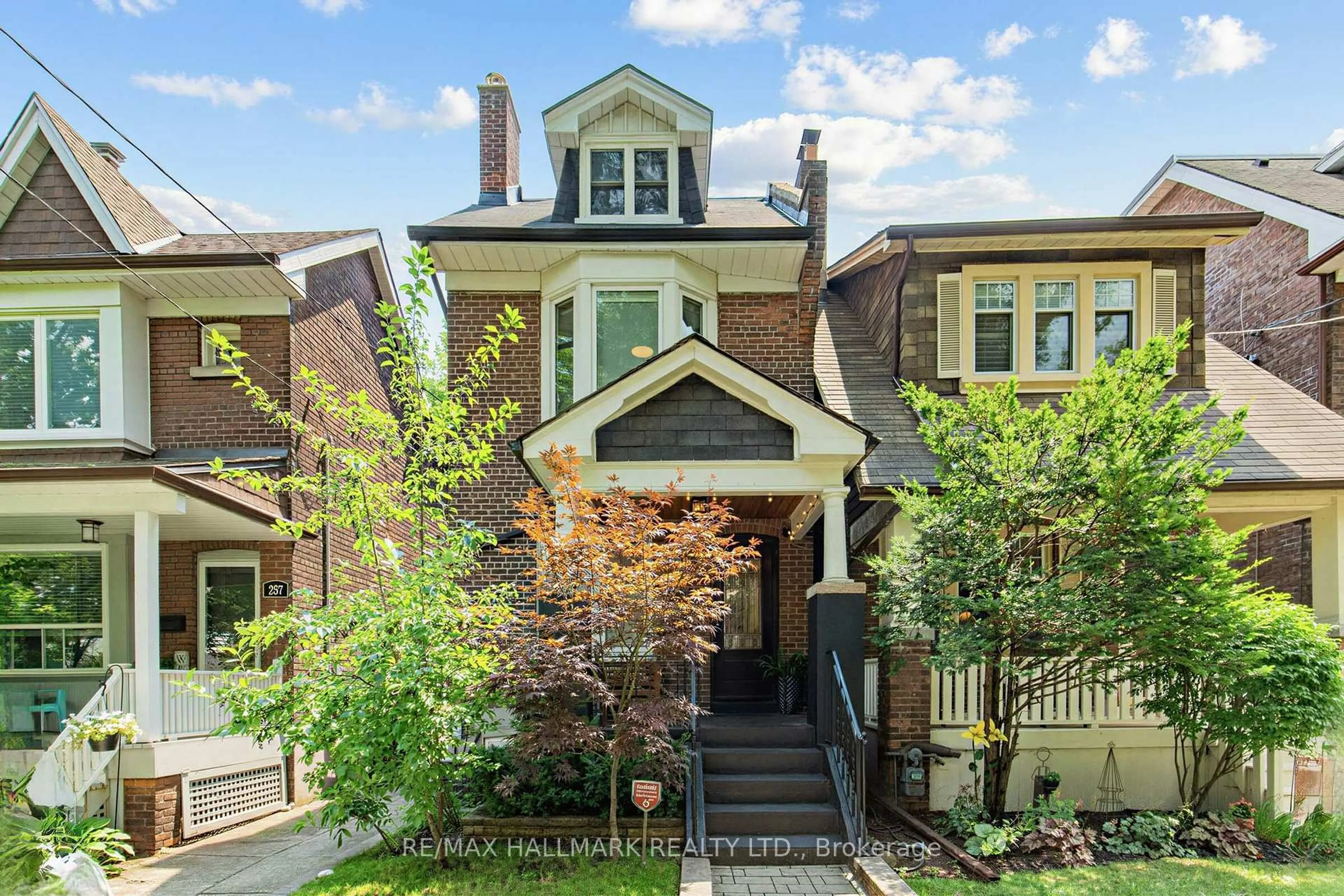 Home with brick exterior material, street for 255 Strathmore Blvd, Toronto Ontario M4J 1P7