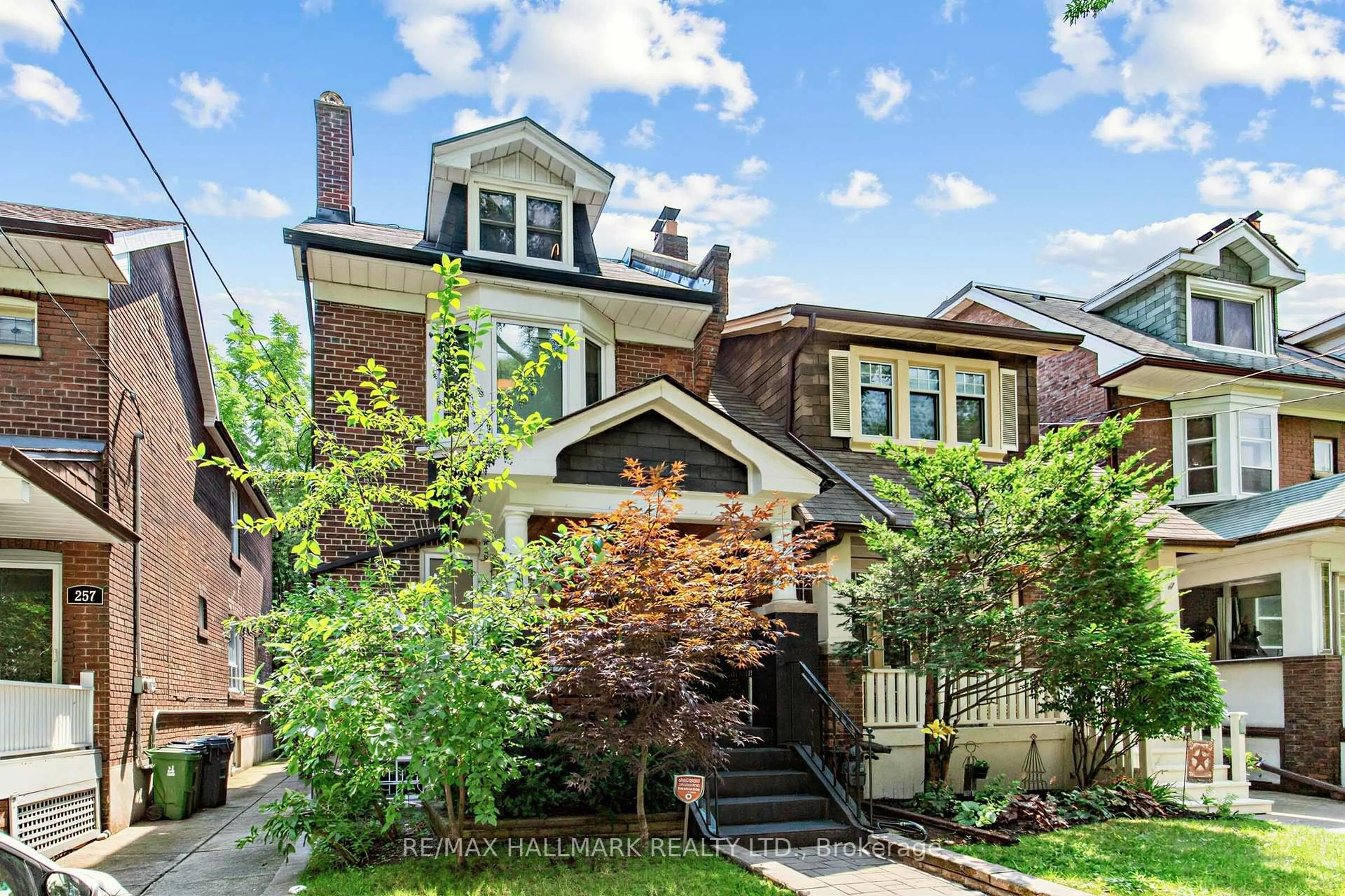 Home with brick exterior material, street for 255 Strathmore Blvd, Toronto Ontario M4J 1P7