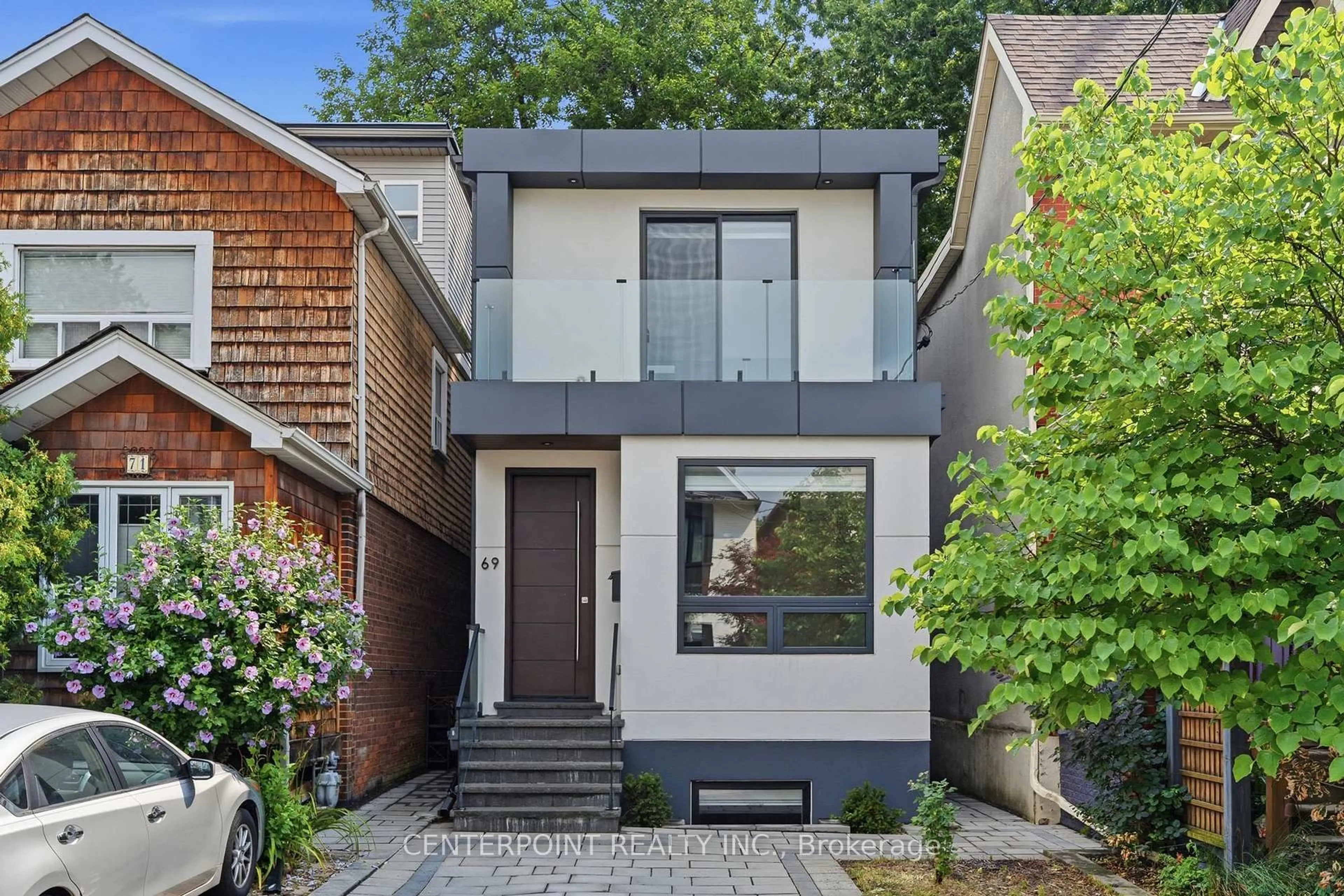 Home with brick exterior material, street for 69 Muriel Ave, Toronto Ontario M4J 2Y1