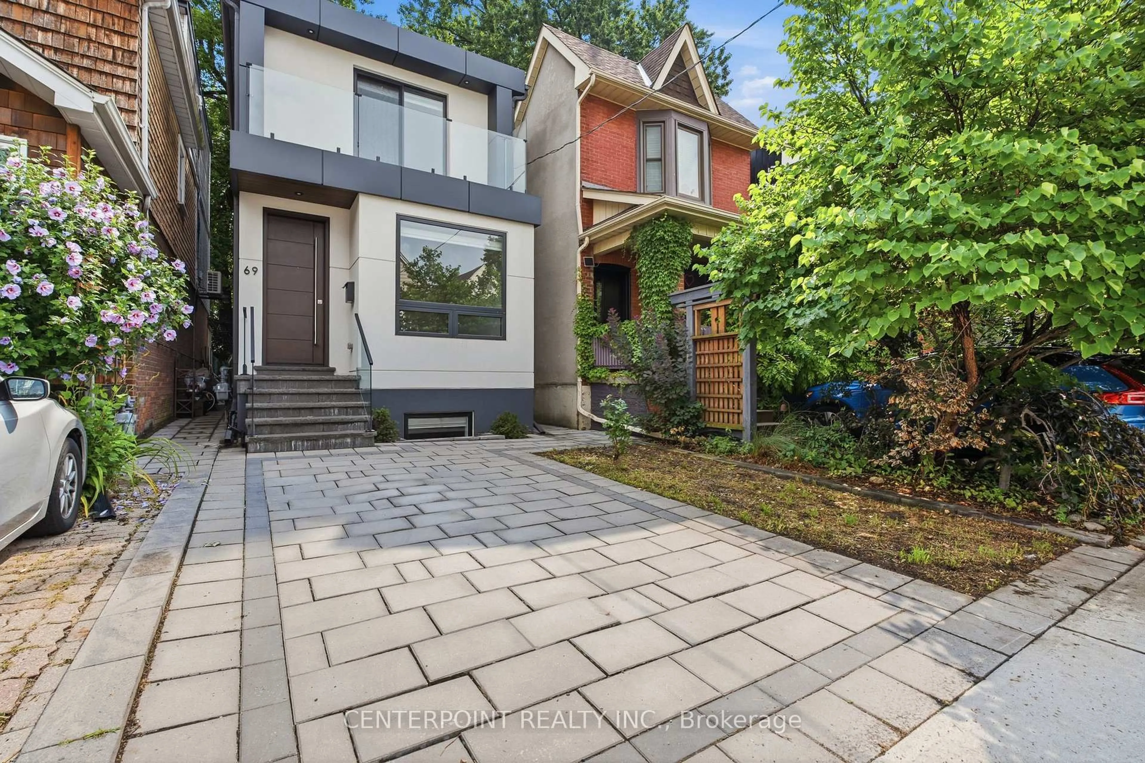 Home with brick exterior material, street for 69 Muriel Ave, Toronto Ontario M4J 2Y1