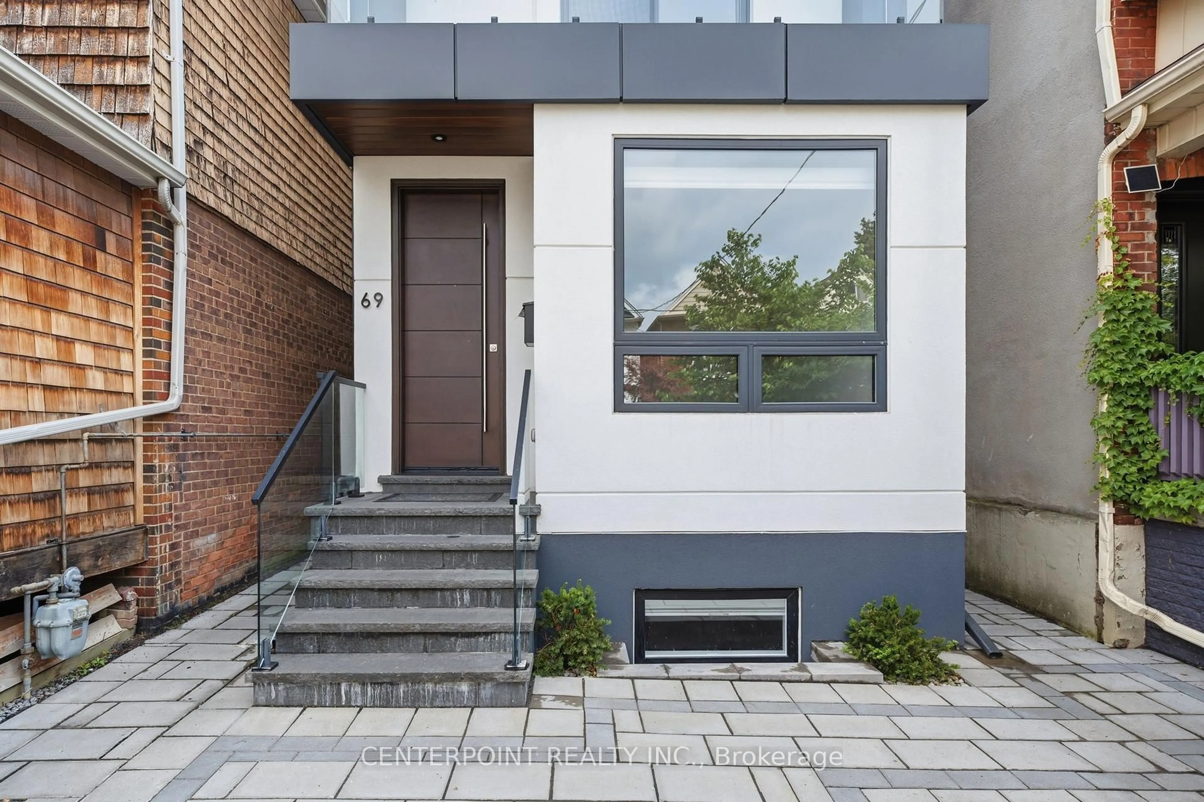 Home with brick exterior material, street for 69 Muriel Ave, Toronto Ontario M4J 2Y1