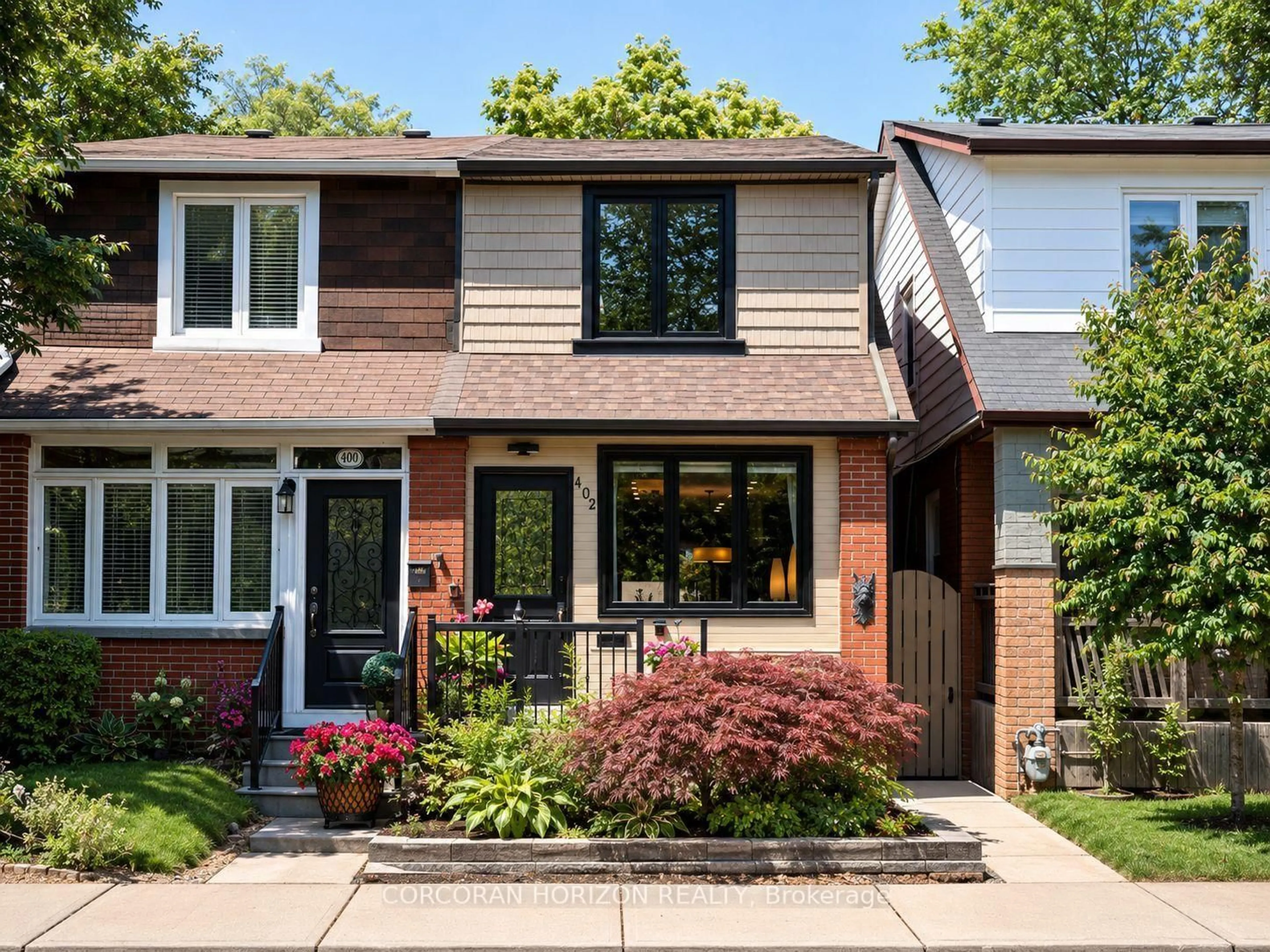 Home with brick exterior material, street for 402 Rhodes Ave, Toronto Ontario M4L 3A5
