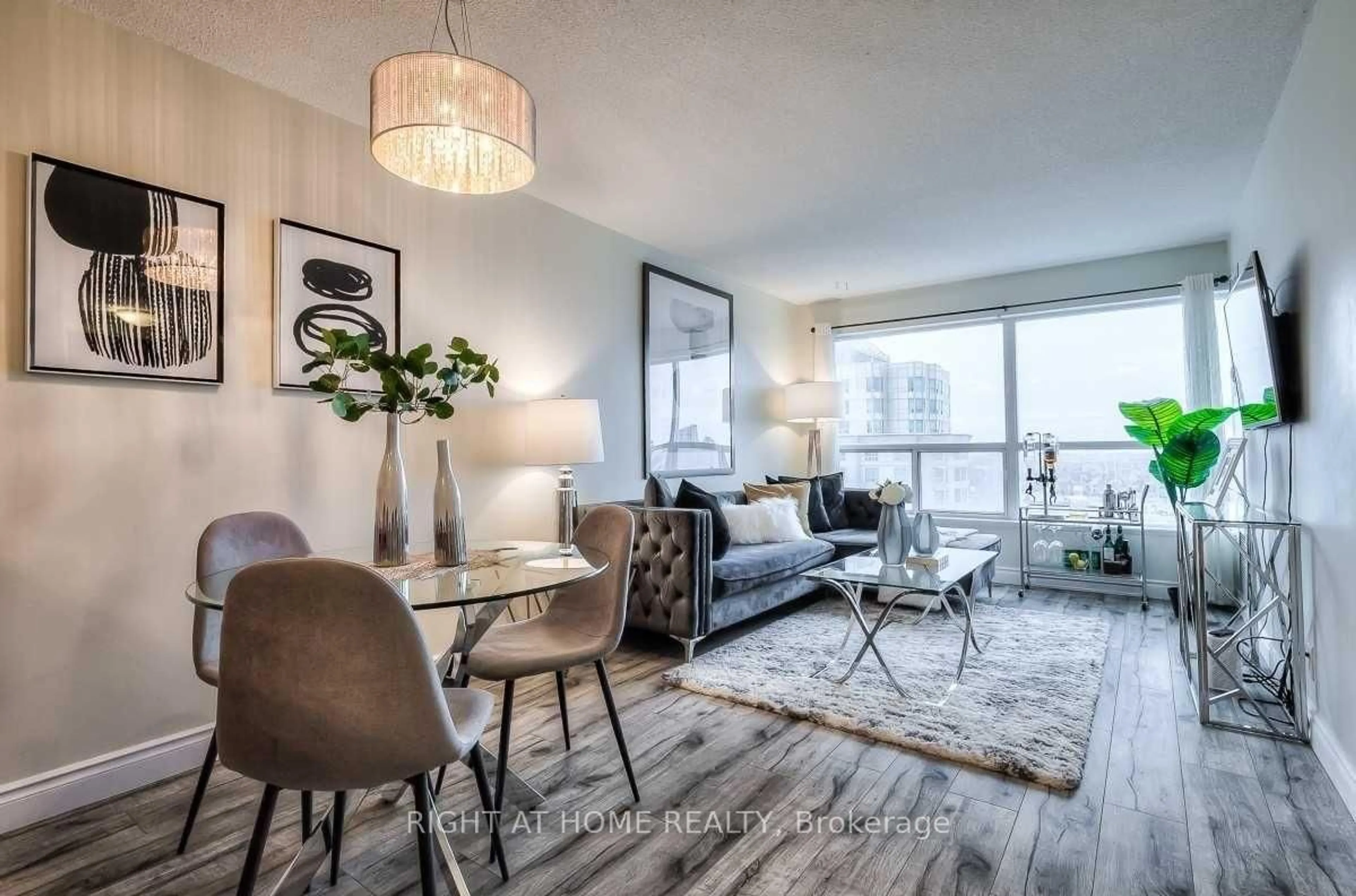 Living room with furniture, wood/laminate floor for 38 Lee Centre Dr #2308, Toronto Ontario M1H 3J7