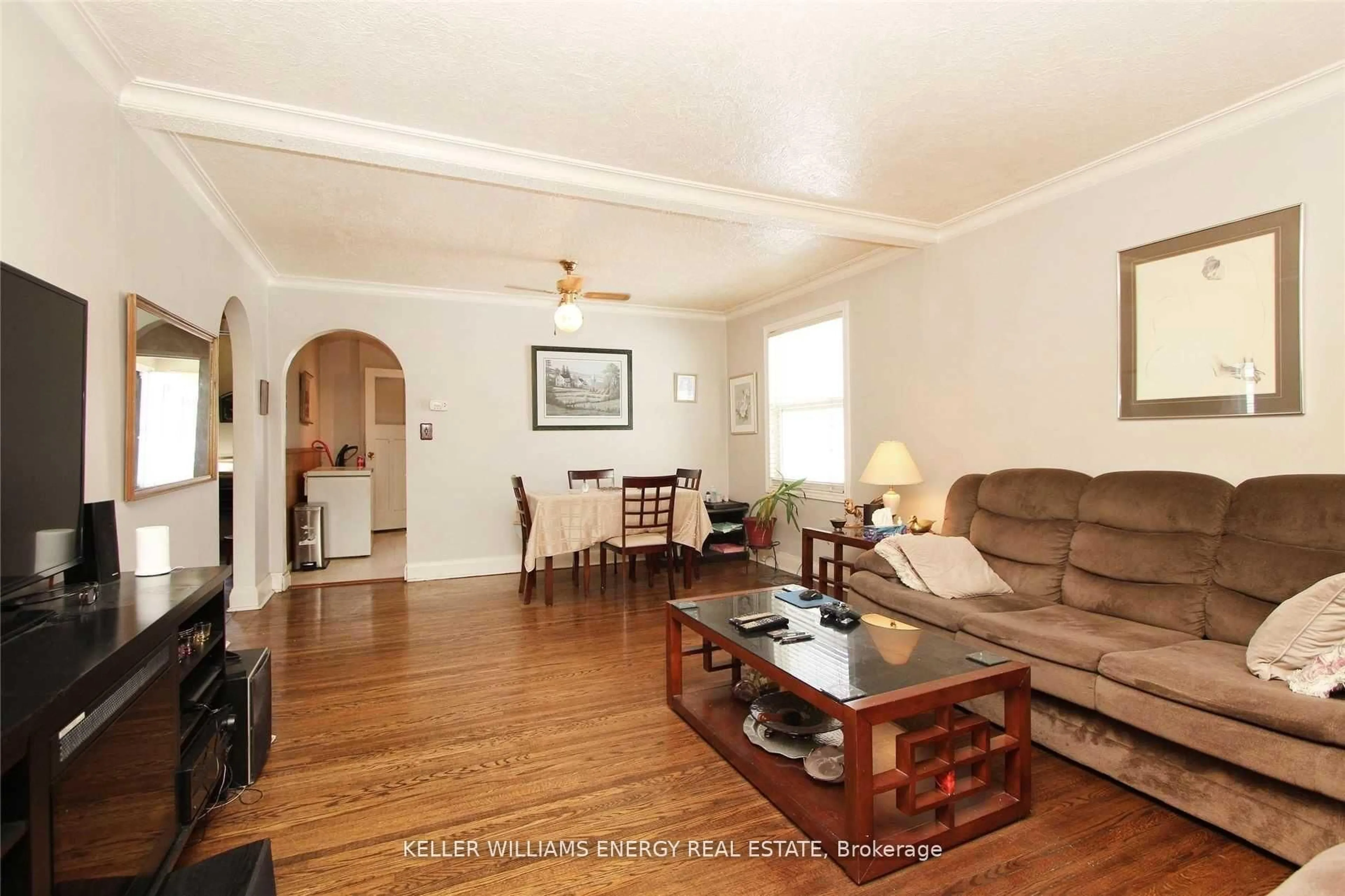Living room with furniture, wood/laminate floor for 64 Grenfell St, Oshawa Ontario L1J 4W2