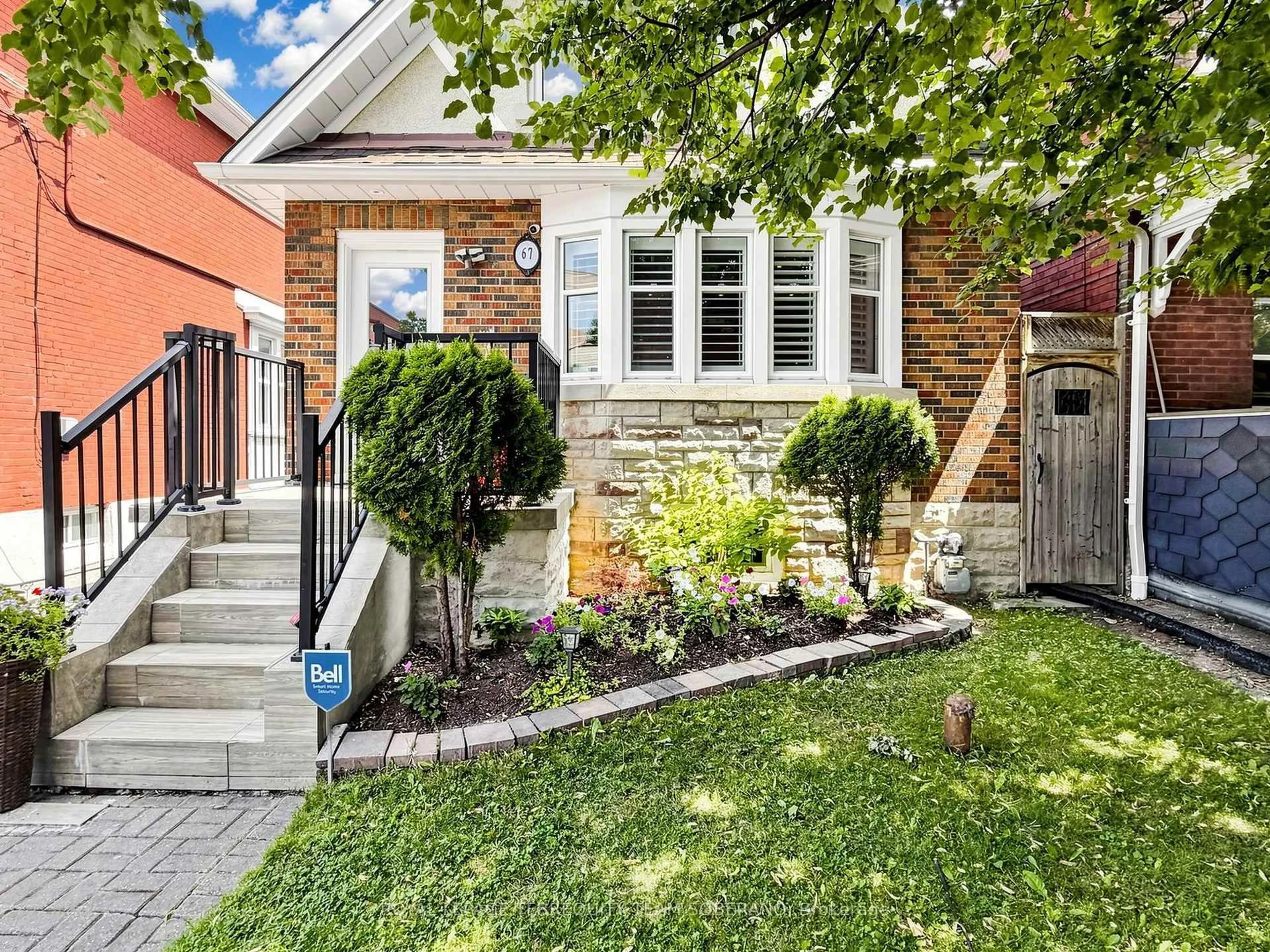 Home with brick exterior material, street for 67 Barrington Ave, Toronto Ontario M4C 4Y9