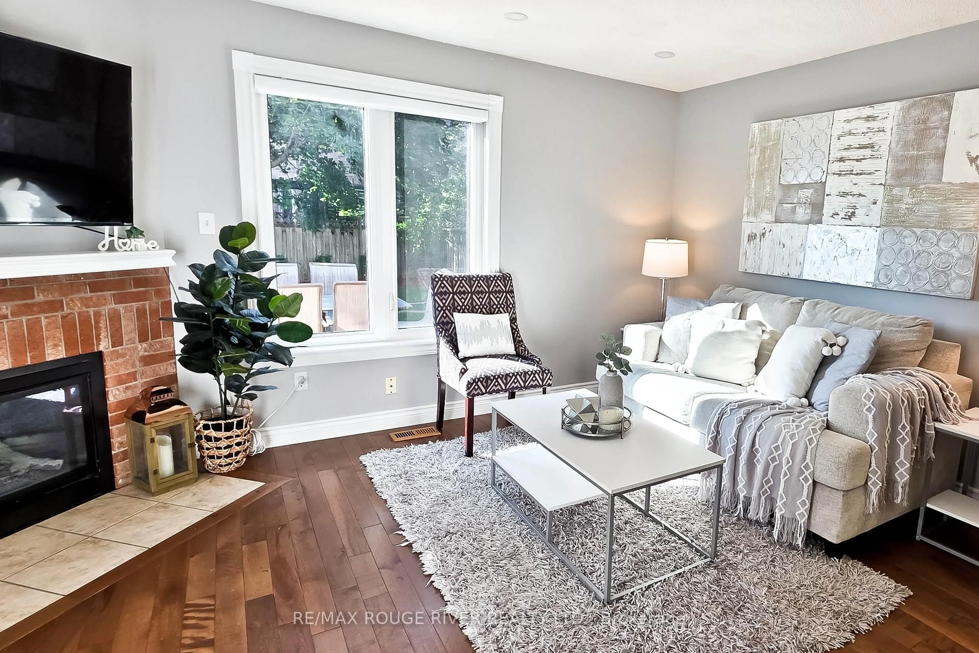 Living room with furniture, wood/laminate floor for 6 Knotty Pine Dr, Whitby Ontario L1R 2J6