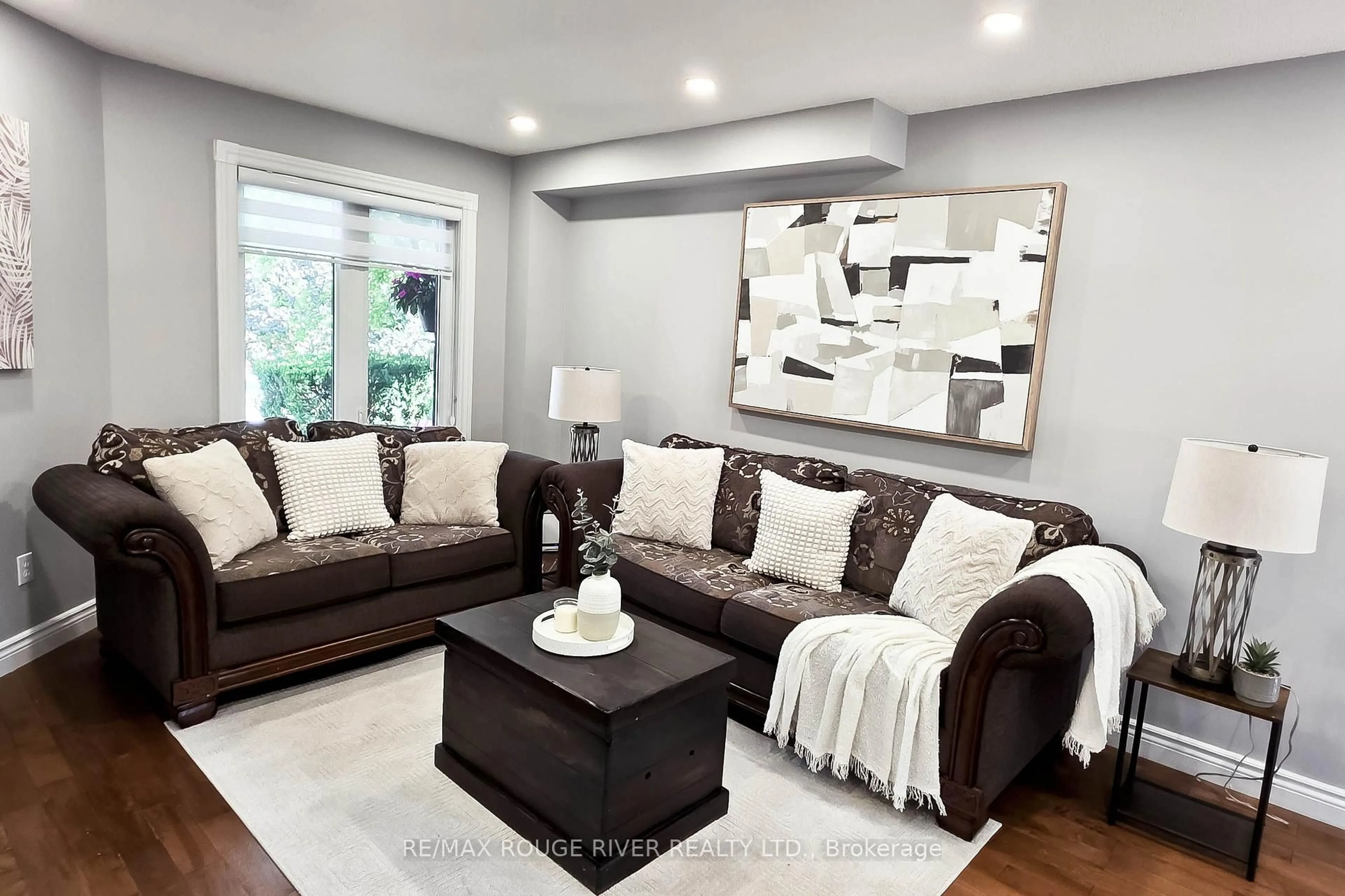 Living room with furniture, wood/laminate floor for 6 Knotty Pine Dr, Whitby Ontario L1R 2J6