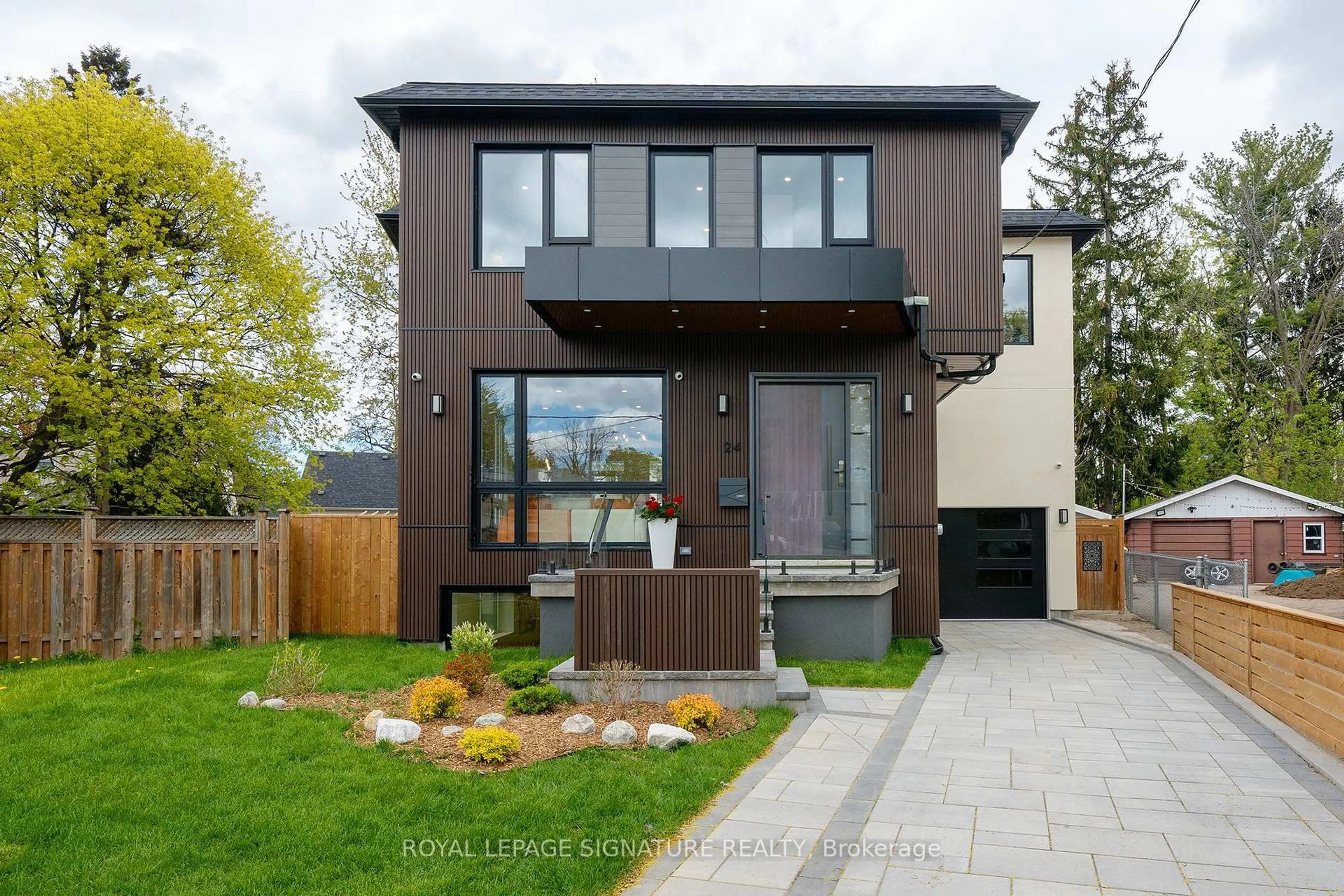 Home with brick exterior material, street for 24 Merritt Rd, Toronto Ontario M4B 3K5
