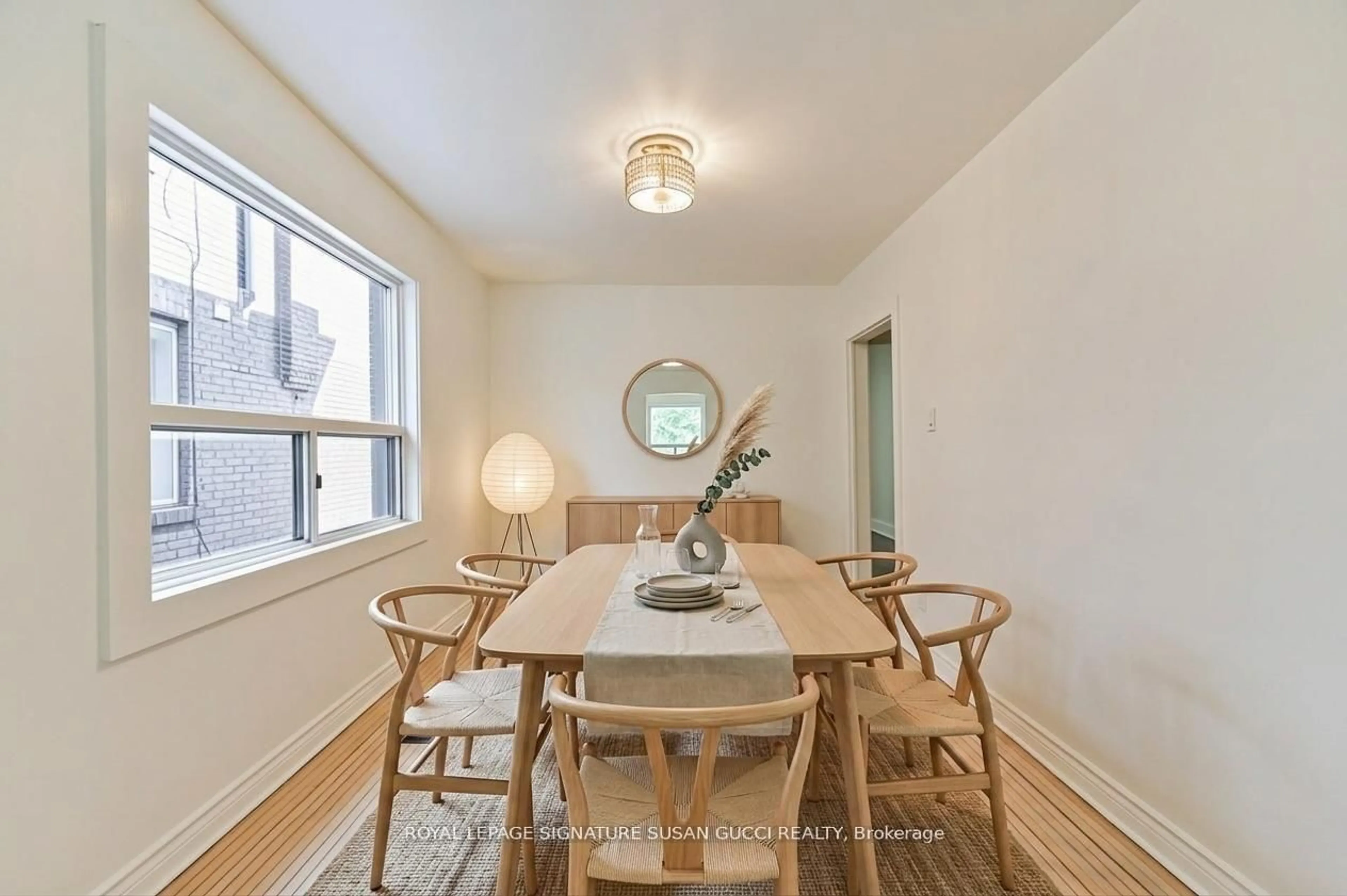 Dining room, wood/laminate floor for 669 Greenwood Ave, Toronto Ontario M4J 4B3