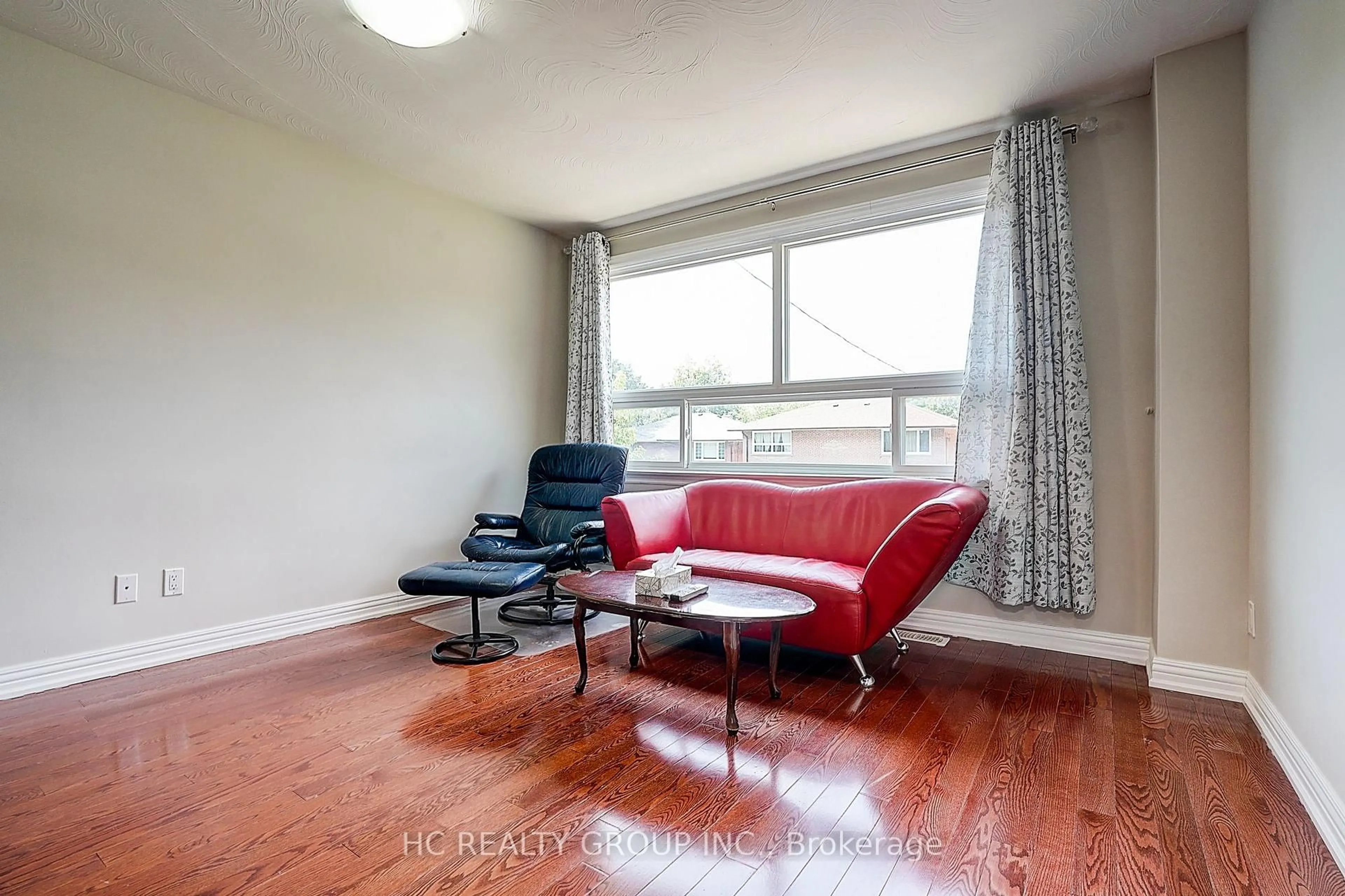Living room with furniture, wood/laminate floor for 361 Highfield Rd, Toronto Ontario M4L 2V7