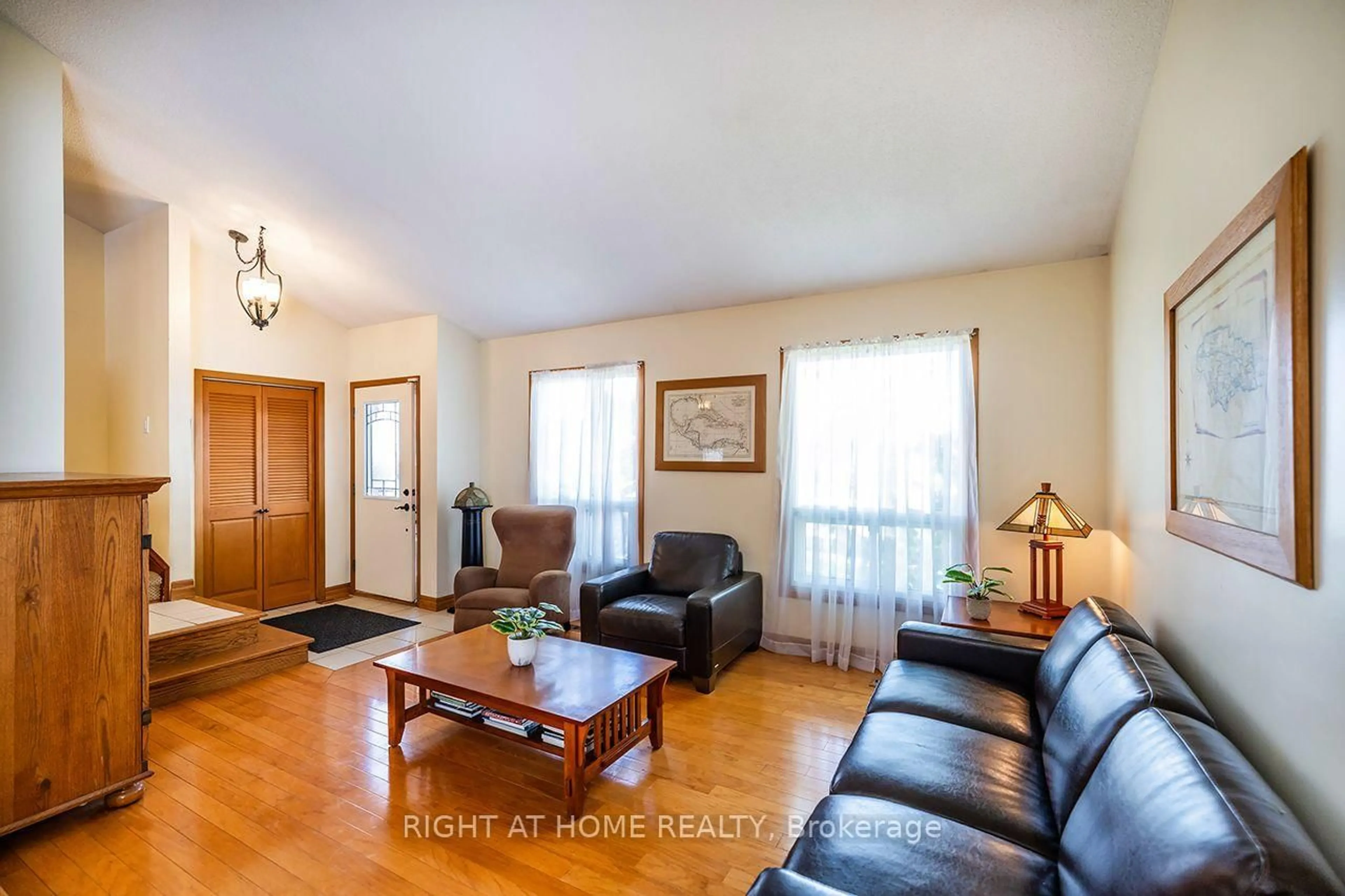 Living room with furniture, wood/laminate floor for 1770 Spruce Hill Rd, Pickering Ontario L1V 1S4