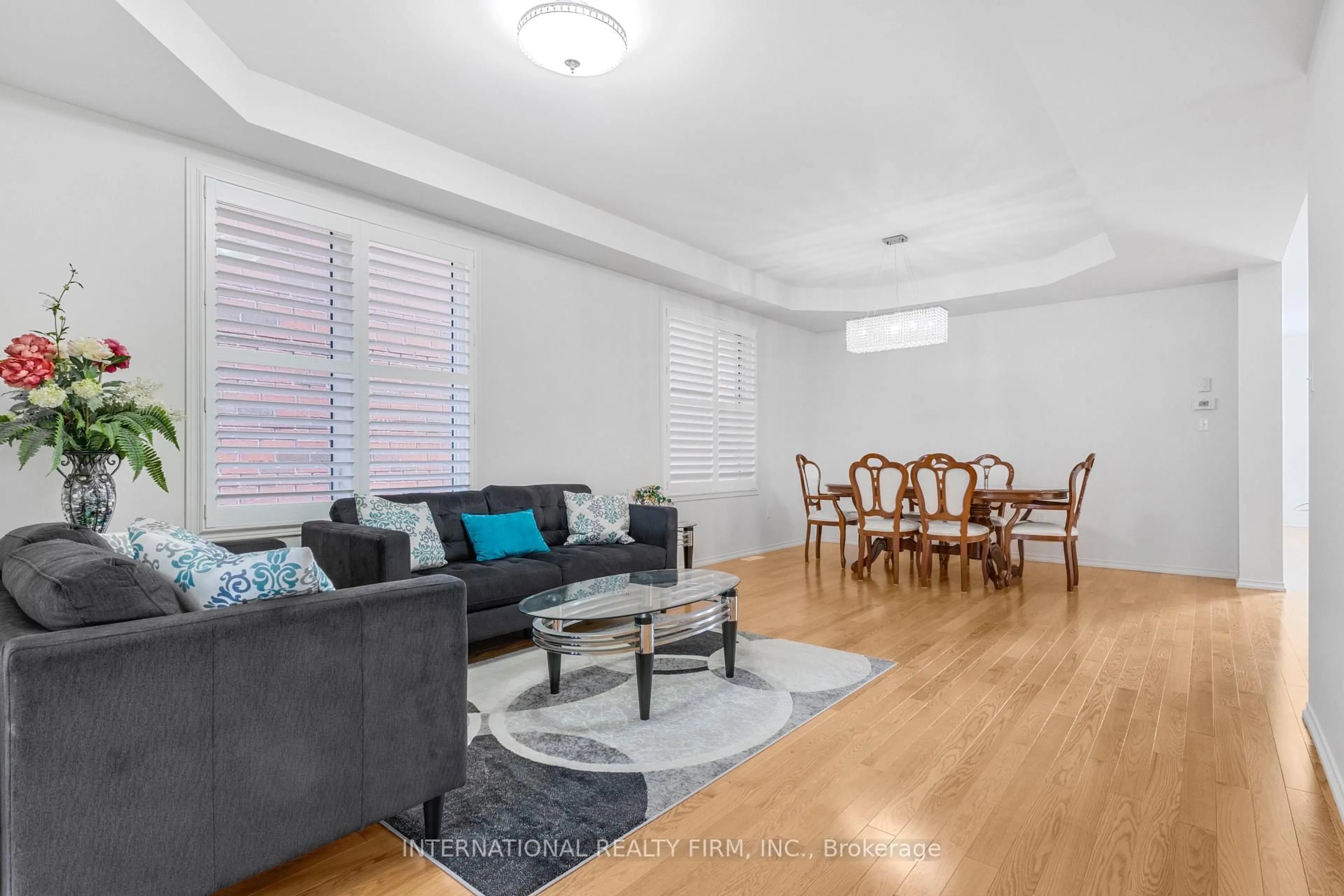 Living room with furniture, wood/laminate floor for 2537 Snow Knight Dr, Oshawa Ontario L1L 0K2