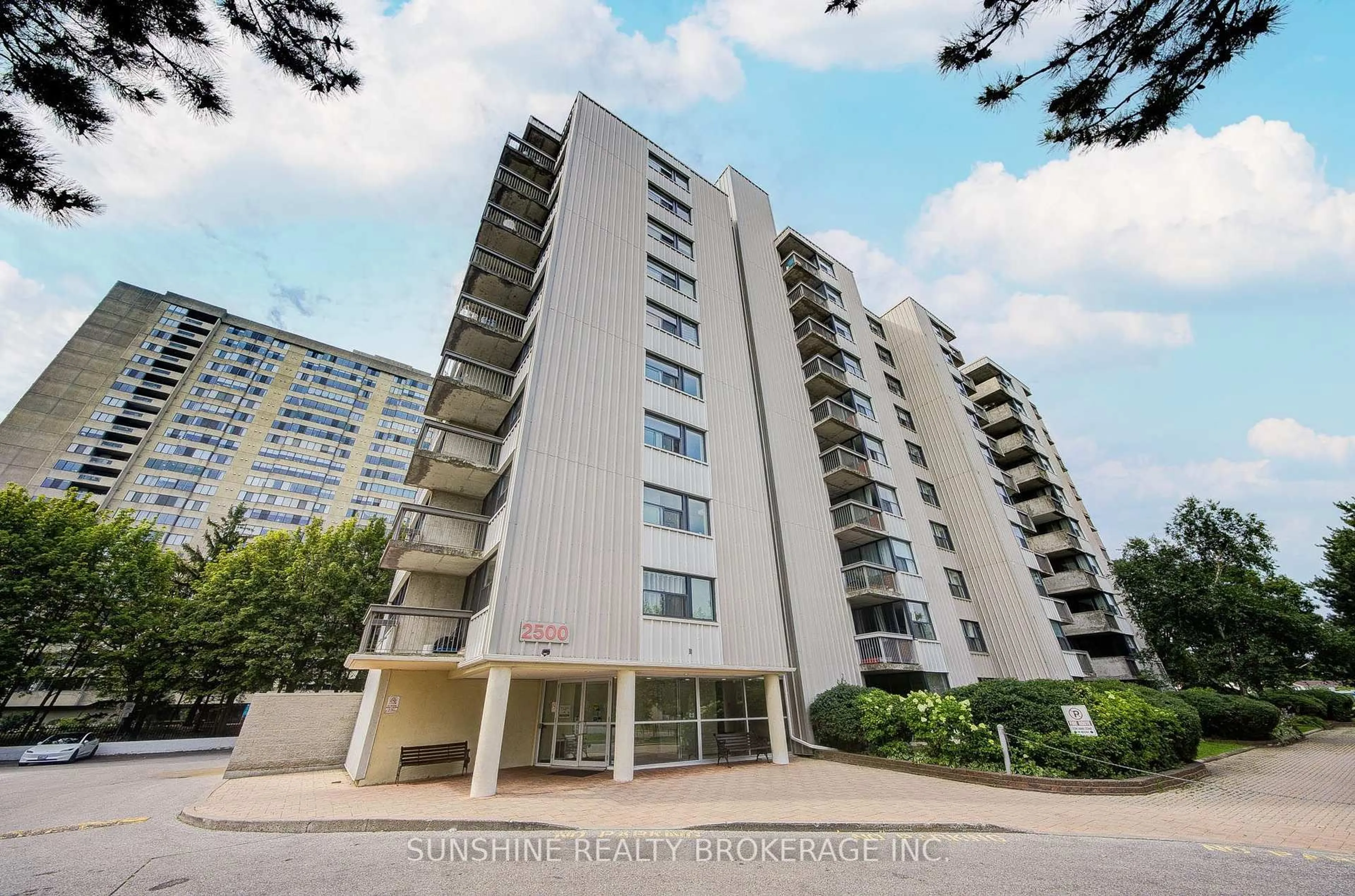 A pic from outside/outdoor area/front of a property/back of a property/a pic from drone, building for 2500 Bridletowne Circ #408, Toronto Ontario M1W 2V6