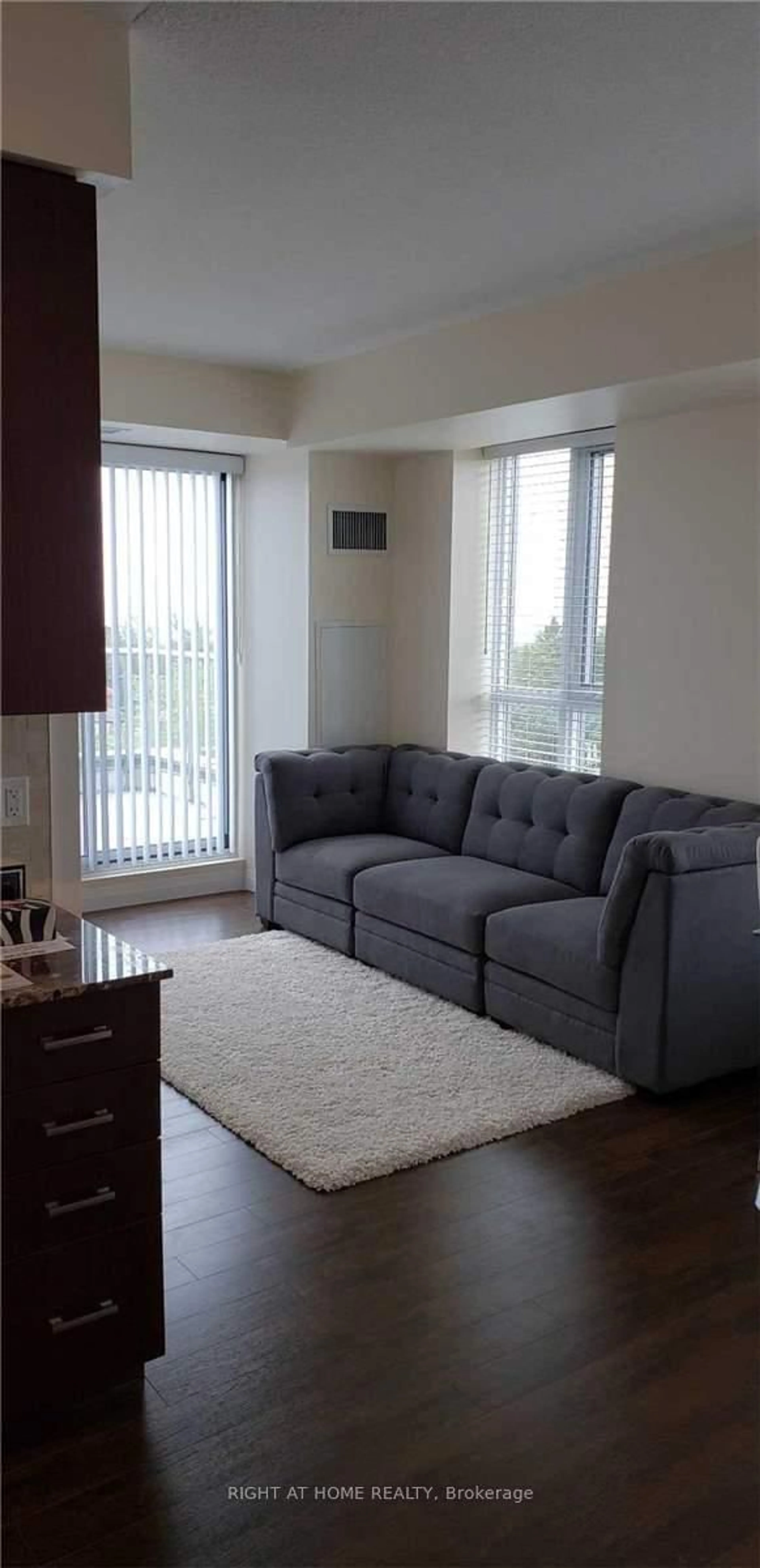 Living room with furniture, carpet floor for 22 East Haven Dr #718, Toronto Ontario M1N 1L9