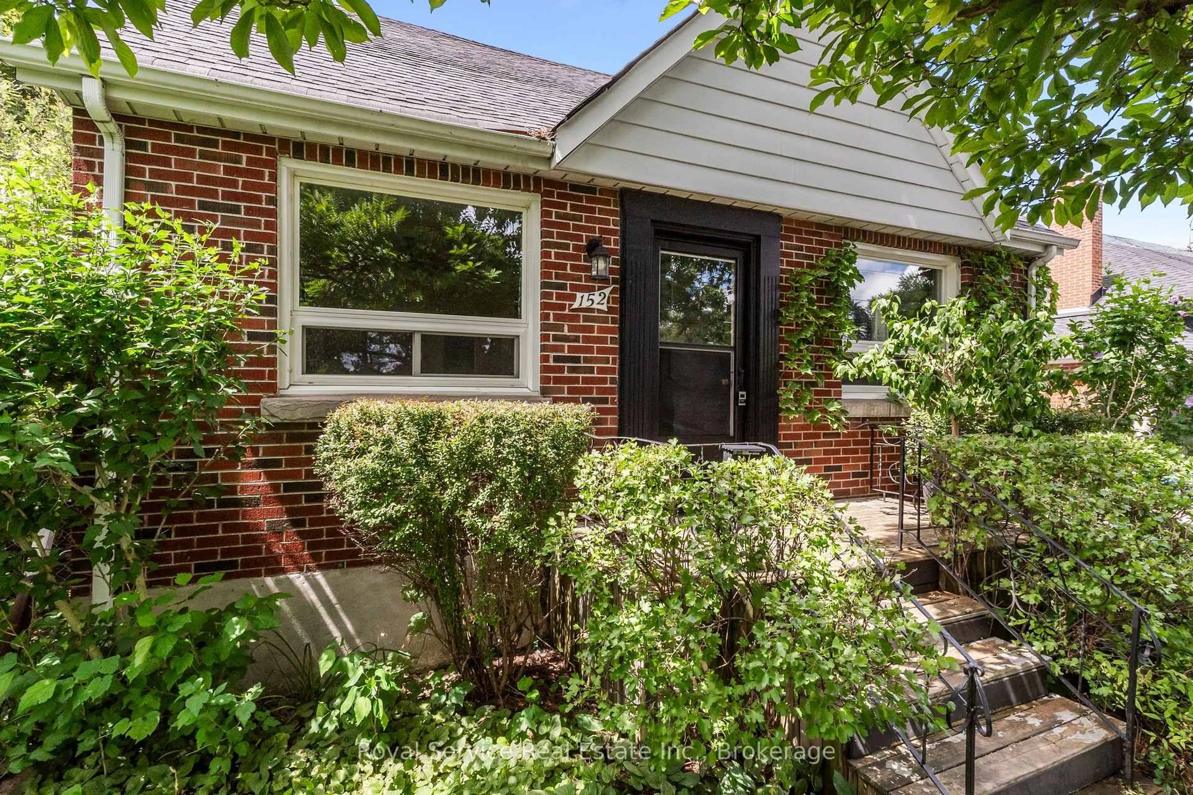 Home with brick exterior material, street for 152 Harmony Rd, Oshawa Ontario L1H 6T5
