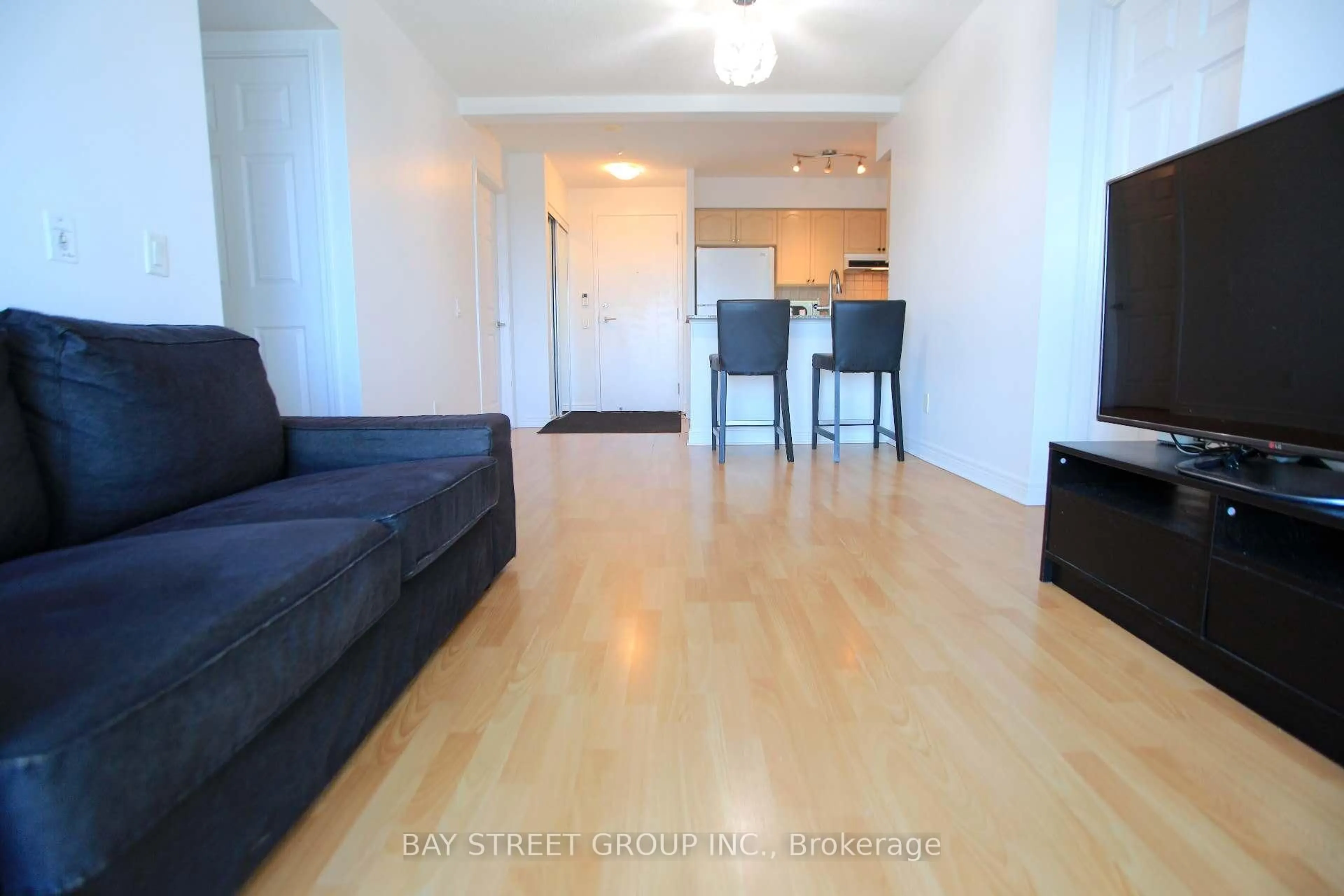 Living room with furniture, wood/laminate floor for 83 Borough Dr #1814, Toronto Ontario M1P 5E4