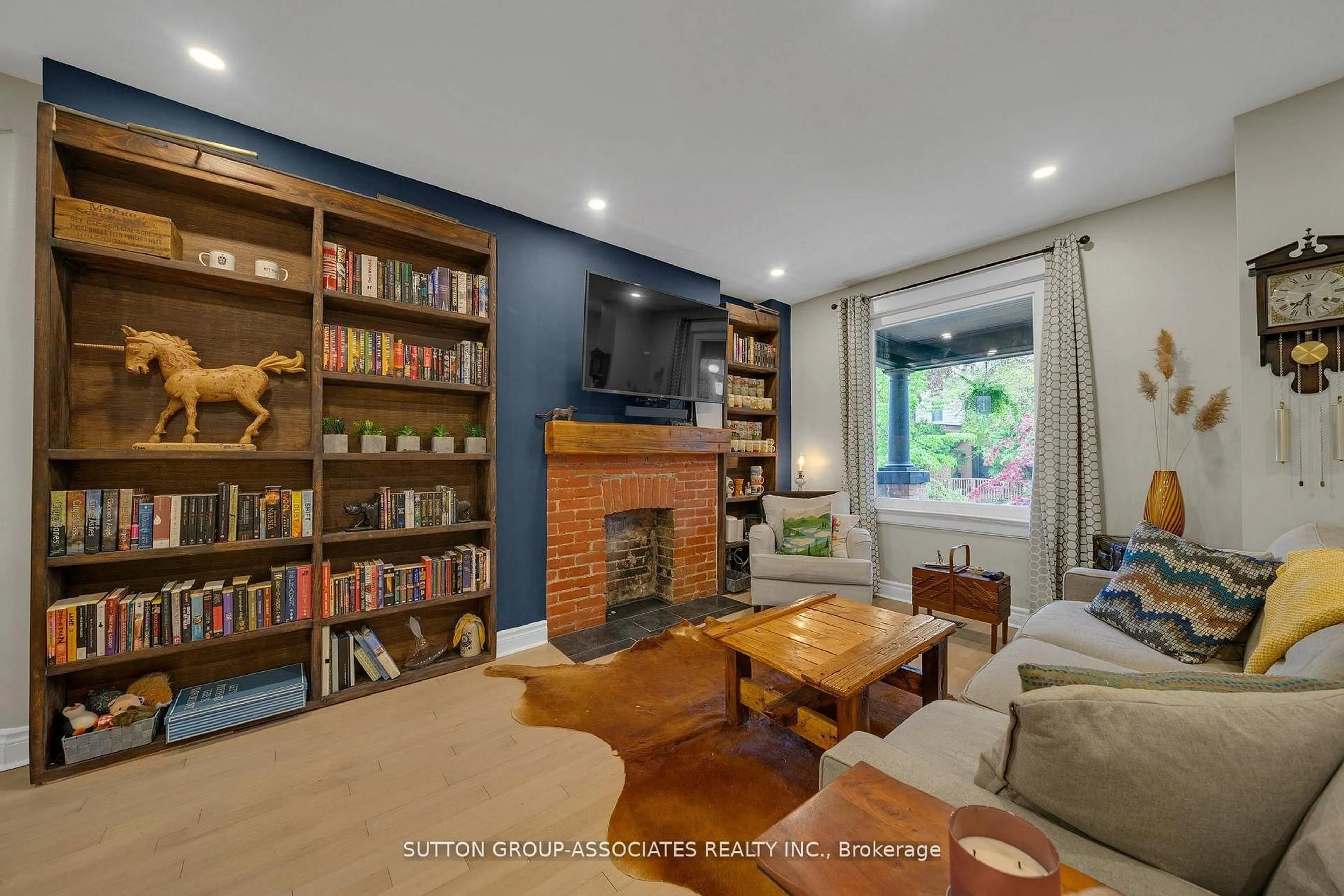 Living room with furniture, wood/laminate floor for 69 Dagmar Ave, Toronto Ontario M4M 1V9