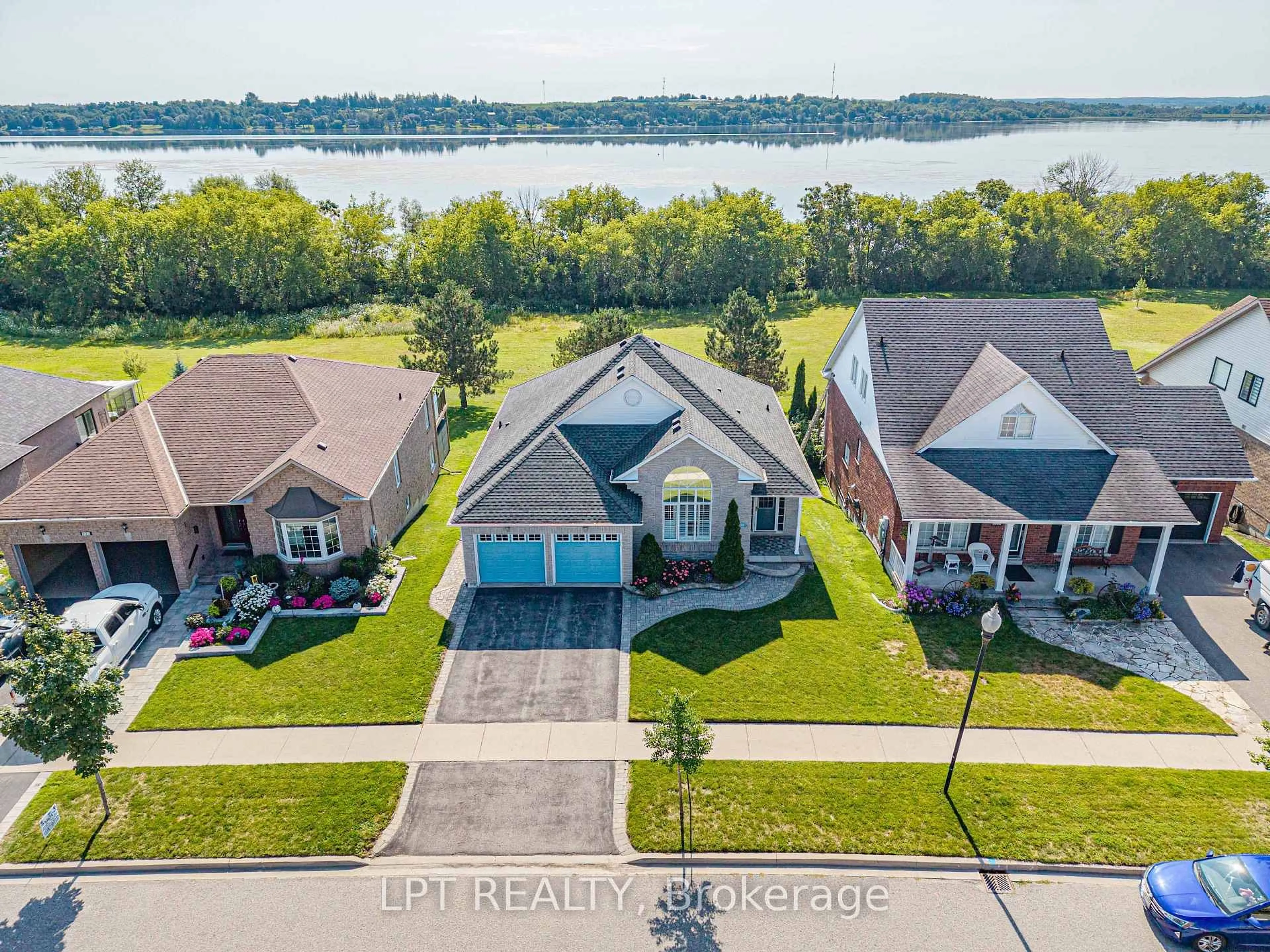 A pic from outside/outdoor area/front of a property/back of a property/a pic from drone, water/lake/river/ocean view for 219 Waterbury Cres, Scugog Ontario L9L 1S5