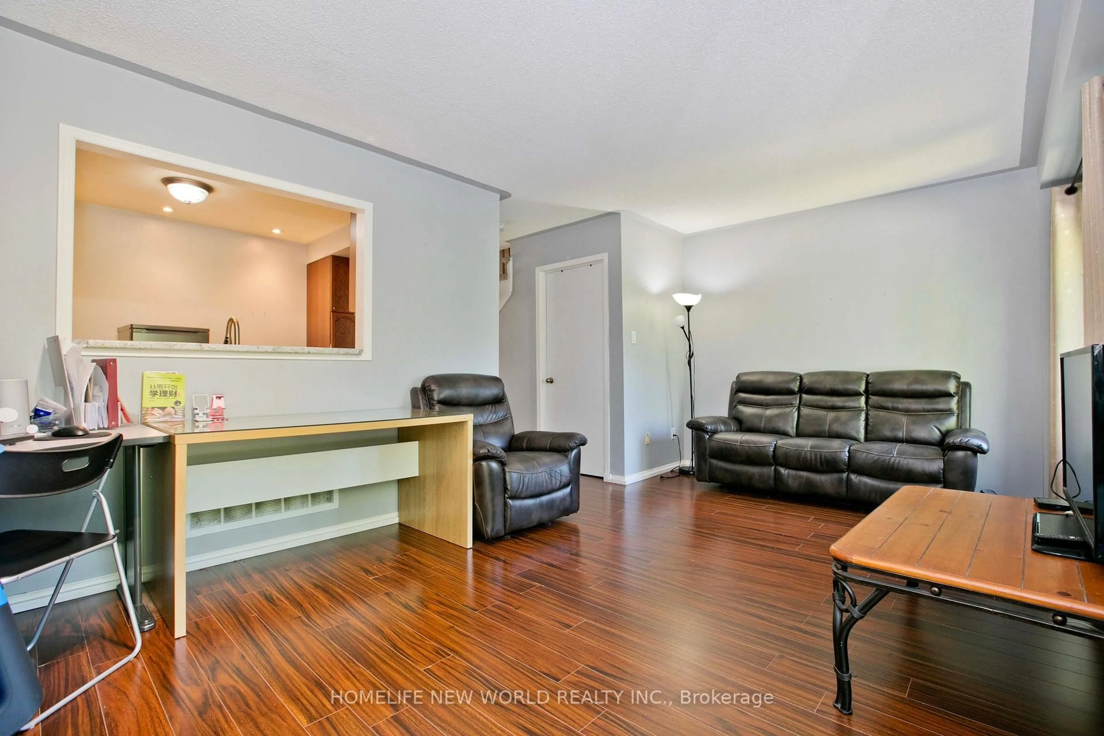 Living room with furniture, wood/laminate floor for 1814 Woodgate Crt, Oshawa Ontario L1G 7Z1