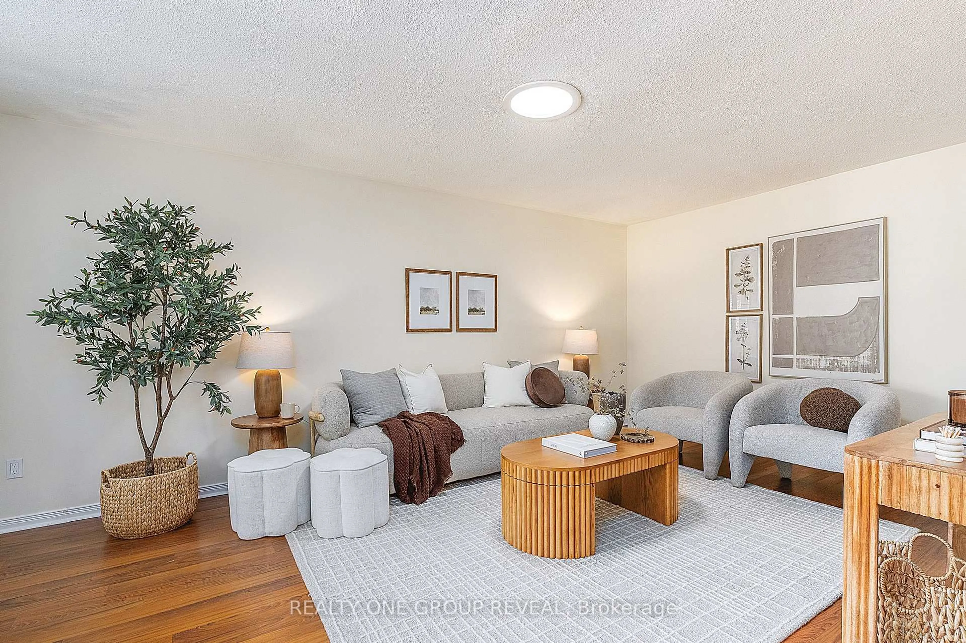Living room with furniture, wood/laminate floor for 133 Calais St, Whitby Ontario L1N 5M3