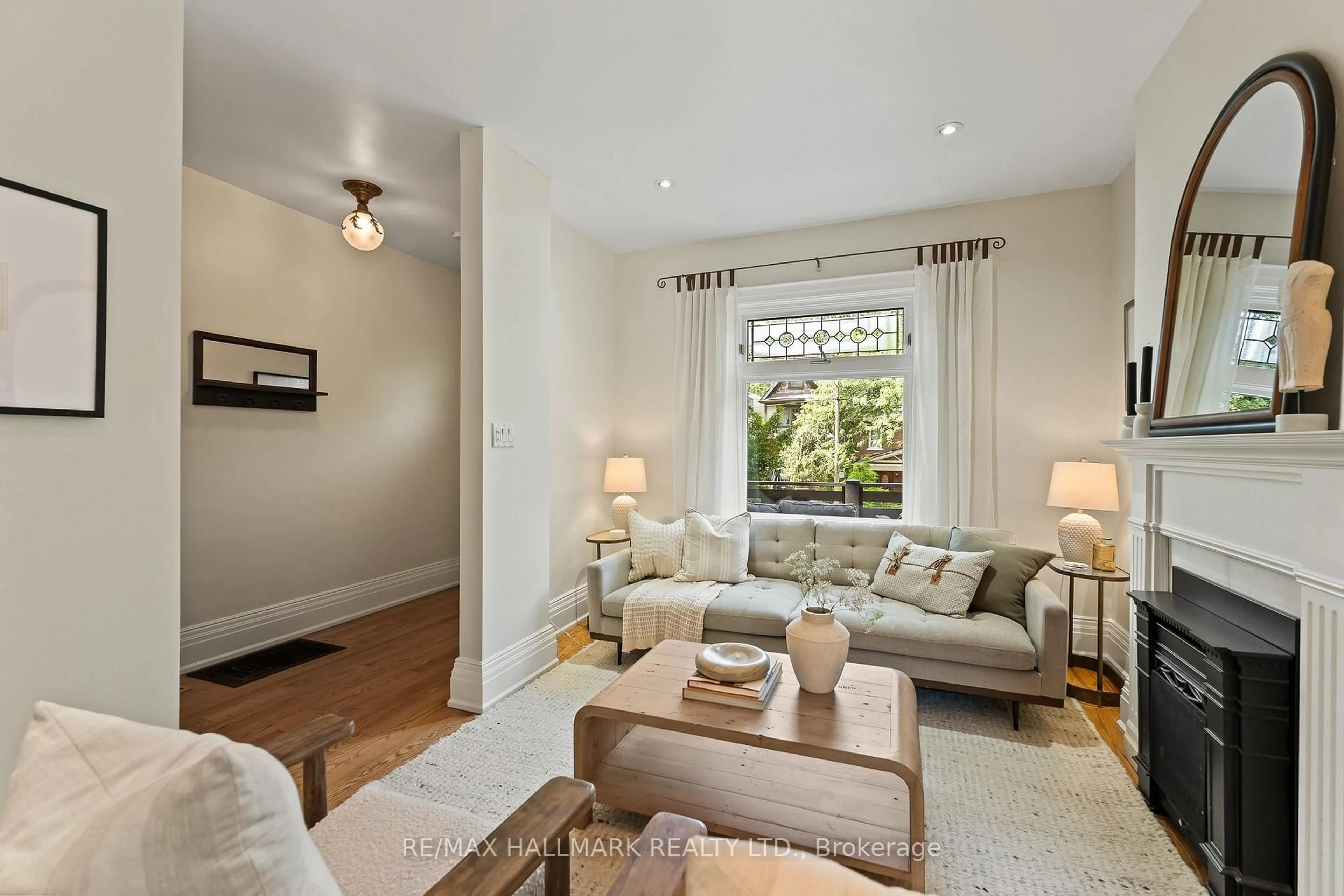 Living room with furniture, wood/laminate floor for 227 Waverley Rd, Toronto Ontario M4L 3T4